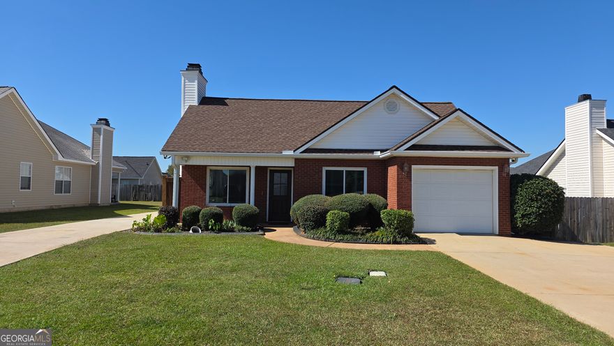 Step into this immaculate single-story gem featuring 3 spacious bedrooms and 2 full baths. Freshly painted throughout, this home boasts a stylish shiplap ceiling in the kitchen, gleaming hardwood floors in the family room and hallway, and ceramic tile in the kitchen and bathrooms. Enjoy peace of mind with a newer roof and windows, plus energy-efficient spray foam insulation in the attic and above the garage. The cozy propane fireplace with gas logs adds warmth and charm, while the custom walk-in pantry and stainless-steel appliances elevate the kitchen. Outside, relax in your private fenced yard complete with a pergola, firepit with seating area, paved patio and walkway, and a spacious 10x20 storage building. ? This home is move-in ready and packed with upgrades-don't wait, it won't last long!