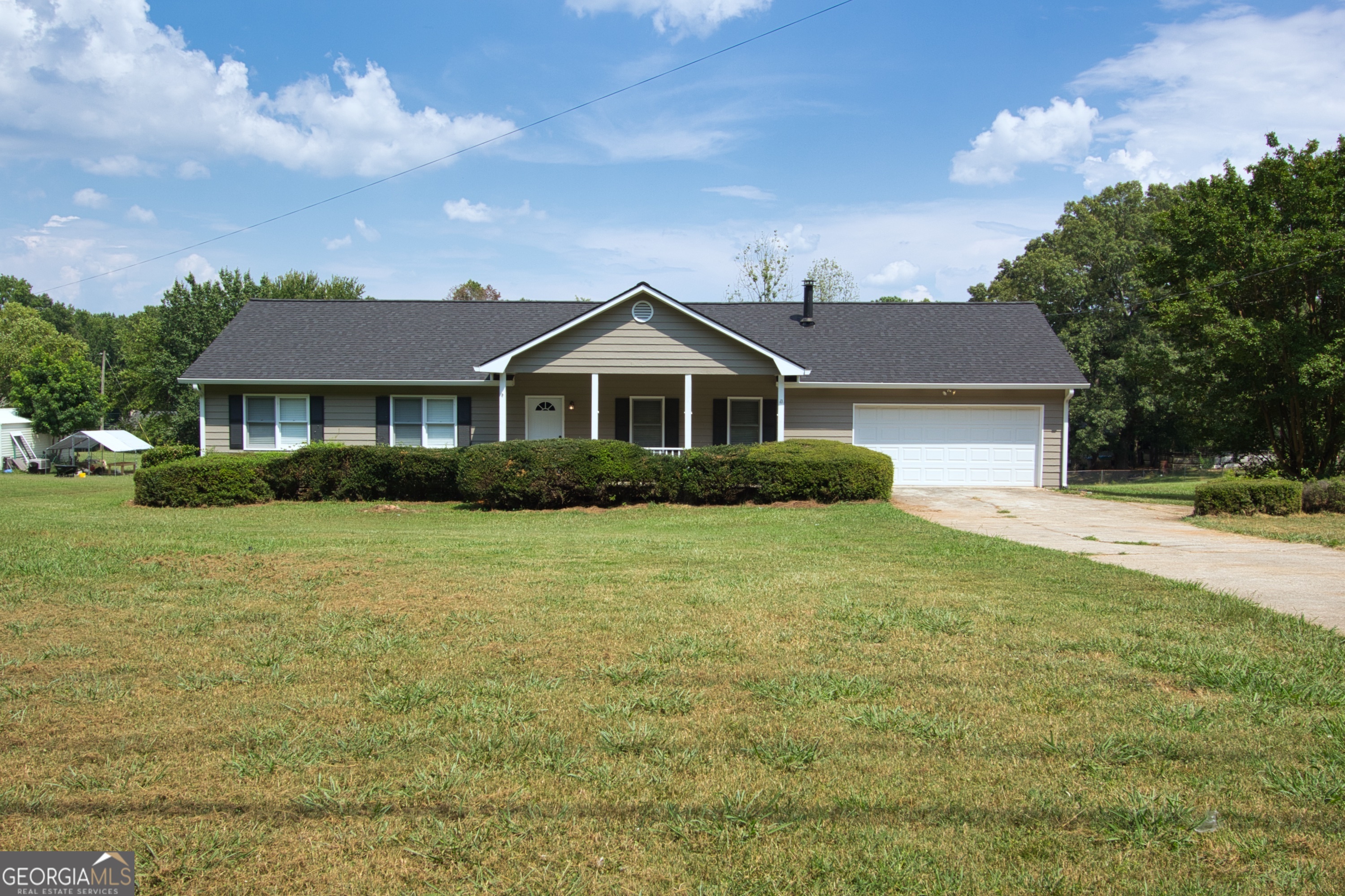 AVAILABLE NOW!! Stunning 3 bedroom, 2.5 bathroom ranch with rocking chair style front porch, oversized deck that opens into a fenced in yard. Spacious living room with fireplace, trey ceilings and built-in bookcase. Kitchen features white cabinets, stainless appliances, refrigerator will be installed at move-in, farmhouse shelves and eat-in kitchen. Half-bath sits right off the kitchen with an attached laundry room. Primary bedrooms has trey ceiling, walk-in closet, and en-suite bathroom with separate shower. (Applicant's total household income must be at least 3 times the monthly rental amount. Applicants must have no prior evictions, have a good credit score, and excellent past rental history. Renters Insurance is required. No pets or Housing Choice vouchers. Please note, our homes are available on a first-come, first-serve basis and are not reserved until the lease is signed by all applicants and security deposits are collected. This is a NON Smoking Property