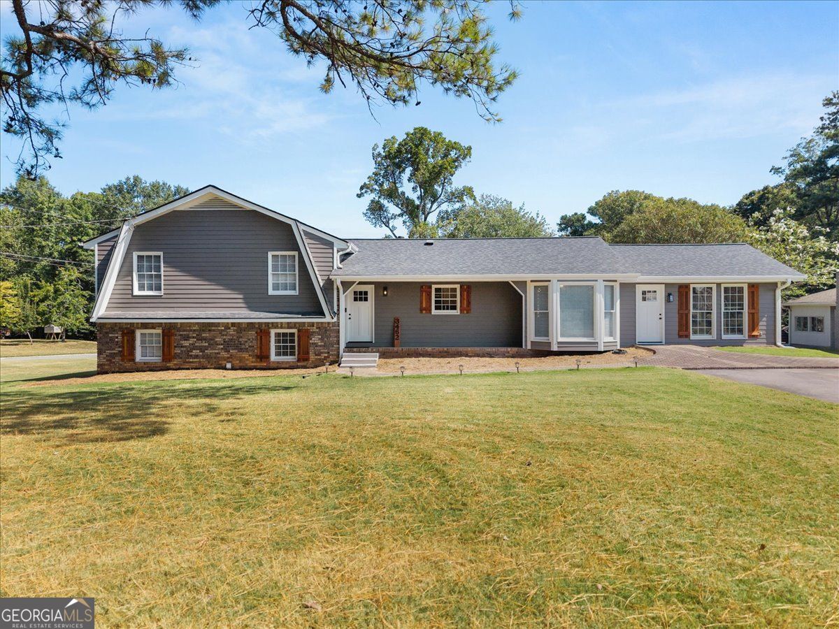 Discover this completely renovated 4-bedroom, 2-bathroom home in Marietta, GA, offering high-end finishes, versatile spaces, and a rare oversized corner lot. This property includes a detached 2-car garage with 220 amp power and a propane system-ideal as a workshop, home business space, or with potential to be converted into a private guest house. Inside, every detail has been updated with designer touches. The chef's kitchen features Cambria Calcetta Lombrea quartzite countertops, LG ThinQ smart appliances, and a spacious layout perfect for cooking and entertaining. Both bathrooms showcase luxury finishes, including carbon steel leather-texture quartz, Gold Fusion marble, and porcelain tile. Additional upgrades include new electrical, modern lighting, ceiling fans, and premium plumbing fixtures. This Marietta home also features red oak hardwood flooring, plush new carpeting, and a flexible bonus room that can be used as a home office, media room, or even a 5th bedroom. Outdoor living is equally impressive, with a castle-inspired gazebo, fenced outdoor space ideal for a garden or pet run, and a brand-new irrigation system. The double driveway and expansive yard provide ample parking and room to enjoy. Perfectly situated, this home offers convenient proximity to The Avenues West Cobb, the area's premier retail and dining destination, as well as the Marietta Square, Kennesaw Mountain State Park, and Dallas Highway, giving you easy access to shopping, dining, recreation, and commuter routes. If you're searching for a renovated Marietta home with a detached garage, bonus room, and luxury finishes, this property delivers it all in an unbeatable location.
