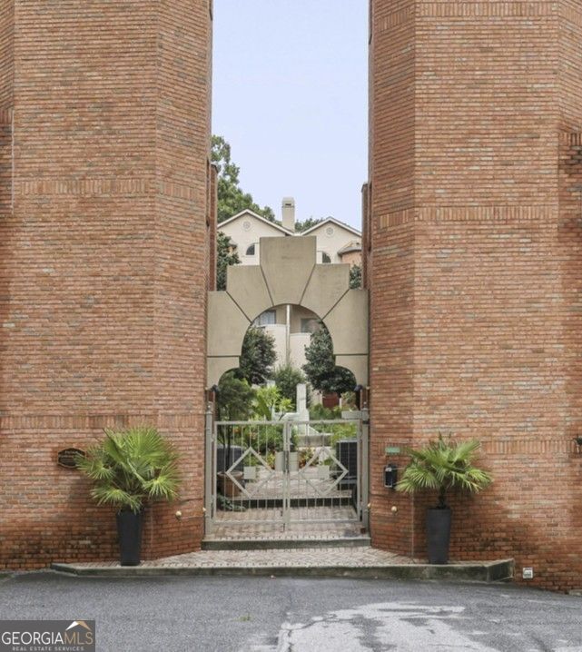 Beautiful Townhome in the Heart of Midtown Atlanta Tucked away in the gated, boutique community of Midtown Square, this beautifully maintained 2-bedroom, 2.5-bath townhome offers the perfect blend of style, comfort, and convenience. With only 16 units in the complex, enjoy a peaceful, close-knit atmosphere in one of Atlanta's most vibrant neighborhoods. Step inside to an open-concept main level featuring hardwood floors, a cozy fireplace, and abundant natural light. The crisp white kitchen is outfitted with stainless steel appliances, stone countertops, and plenty of cabinet space-ideal for cooking and entertaining. Upstairs, the smart roommate floor plan includes two spacious bedrooms with en-suite baths, plus a versatile bonus room perfect for a home office, gym, or creative studio. A front-facing balcony provides the perfect spot to unwind, while the beautifully landscaped courtyard just outside your front door adds a touch of serenity. Additional highlights include a two-car garage with ample storage, fresh carpeting in the bedrooms, and unbeatable walkability to Piedmont Park, top restaurants, shopping, and the Midtown MARTA station. This is Midtown living at its best-don't miss it!