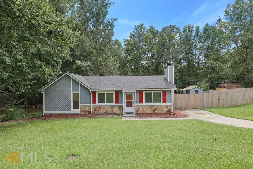 Updated 4 bedroom Ranch in the City of Snellville!!! Amazing house and an amazing location...does it get any better? The beautiful home is set on a spacious lot and greets you with new exterior paint, a 5-year-old roof, an amazing fenced backyard, a creek, and 2 outbuildings with workshop and storage space! The interior offers an updated kitchen with white and grey cabinets, a new floor, a cozy fireplace, updated paint throughout, and a private owners' suite with a large closet and a new bathroom. Don't miss your chance to purchase this before it's gone!