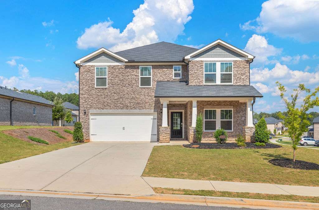 This is your opportunity to own the largest floor plan in Creekside at Oxford Park in a bustling park of South Fulton. This 3-sided brick Taylorsville floorplan, built in 2022, feels like new and is loaded with energy-efficient features. Offering over 3,200 sq ft, the home includes 5 bedrooms and 4.5 baths with a dedicated guest suite and full bath on the main level. The layout is perfect for multi-generational living or guests. Spacious and with tons of room for storage, this integrated living space flows seamlessly from the kitchen into the living and dining spaces. A flex loft upstairs adds versatility for a media room, office, or play area, while the primary suite offers an en-suite and large walk-in closet. Designed with Meritage's advanced energy-saving systems. The home is still under the builder's structural warranty and has been designed to including features such as spray foam insulation, high-efficiency HVAC, and smart home integration providing long-term savings for the new homeowner. Creekside at Oxford Park offers easy access to trails/parks, local shopping and dining in Downtown Fairburn. The community has it's own pool, playground and clubhouse.