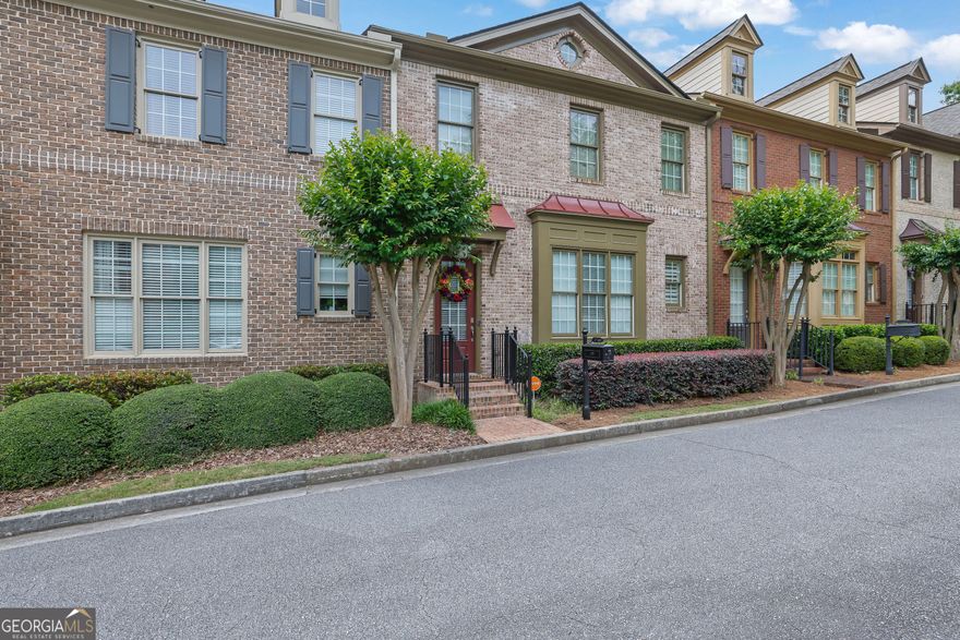 Seller will pay 12 months of HOA fees - a value of $5160 and include certain furniture items - reach out to listing agent for complete list. Excellent townhome community in the heart of John's Creek - rated the #1 suburban area in Georgia by Niche.com. This charming John Willis townhome has been freshly painted and features extensive millwork throughout, open concept floorplan with gourmet kitchen and adjoining office, fireside family room with built-in bookcases to showcase your books or collectibles, and a generous open concept dining room. Upstairs you will find the owner's suite with sitting room, additional ensuite bedroom and bath, and full laundry. Sitting room can be also used as an additional bedroom. The basement is finished with full bath, bedroom and optional office/workout space. Two-car garage has additional storage area. Rear patio is private and overlooks serene woods. The school cluster is highly-regarded and consistently scores in the top ten schools in Georgia. This home is conveniently located near Shopping, Dining, State Bridge Road, Ocee Park, GA-141, and everything Alpharetta/Johns Creek has to offer! Subdivision allows rentals - no cap. Two-car garage in back; plenty of guest parking in the front.