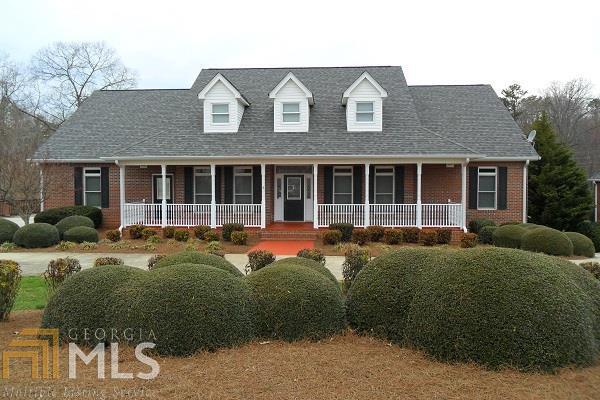 BRICK BEAUTY! Close to downtown Clarkesville. 4BR/3.5BA and a 3 car garage on the main level!! Finished room and bath with den area on terrace level with another garage door entry. Formal dining, eat-in kitchen breakfast bar, solid surface counter tops, wood flooring throughout and built-ins by fireplace. Terrific sunroom/office. Two closets in master. Don't miss this golden opportunity.