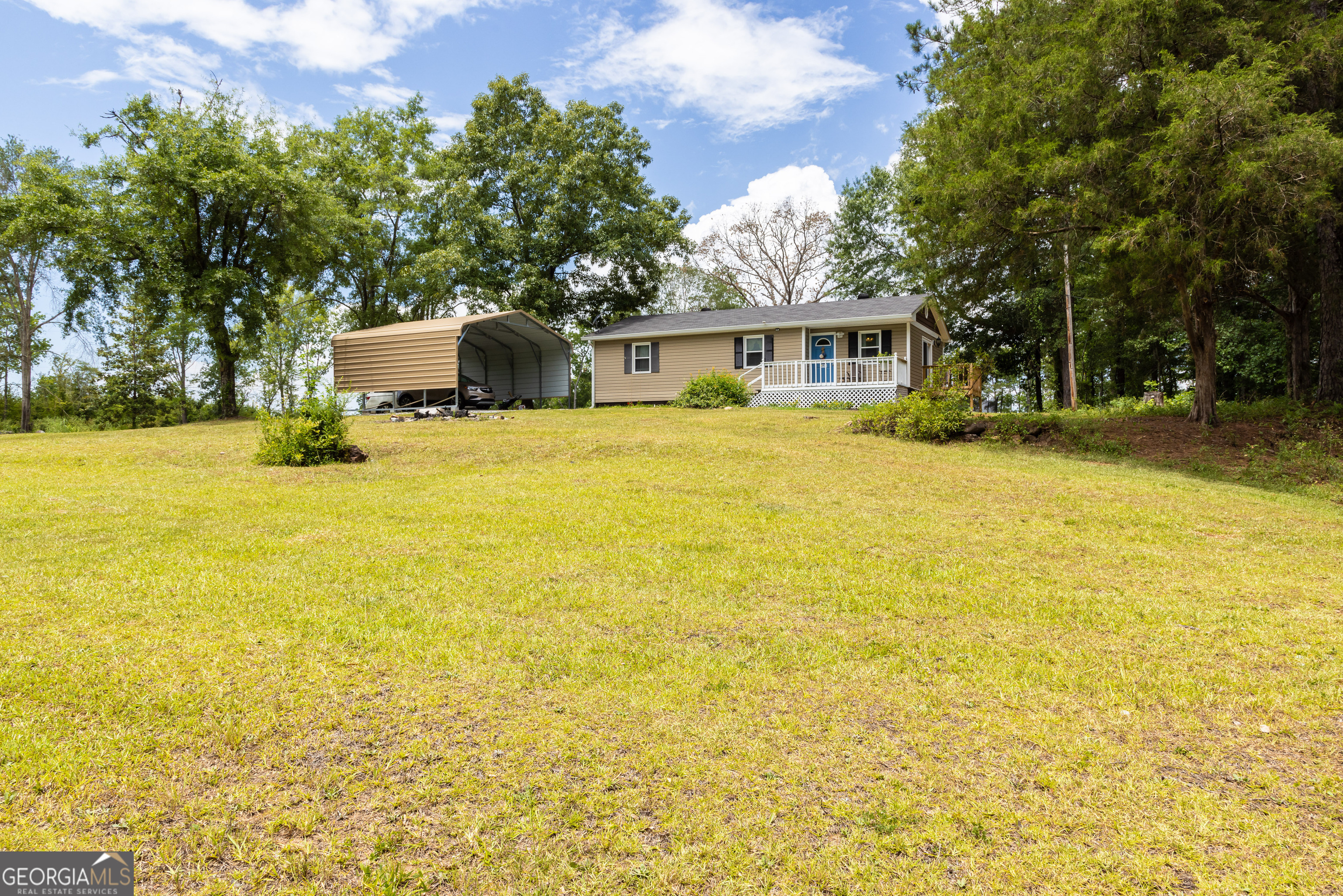 Welcome to this exquisitely remodeled 3-bedroom, 2-bathroom, stick-built, ranch-style home, meticulously crafted with quality and comfort in mind. Nestled on a serene lot just under one acre, this property offers unparalleled tranquility and privacy while remaining conveniently accessible.    Step inside to discover a freshly renovated interior adorned with newly painted walls that create a bright and welcoming atmosphere. The open-concept living area is perfect for both relaxation and entertaining, complemented by tasteful finishes throughout.    Modern updates abound, including a brand-new water heater ensuring your comfort and convenience year-round. This stick-built home showcases superior craftsmanship, promising durability and lasting value for its new owners.    Outside, the expansive lot beckons with its potential for gardening, outdoor recreation, and peaceful moments amidst nature. The driveway has been recently upgraded with new gravel, adding to the property's functionality and curb appeal.    A new carport and storage building are included, providing ample space for vehicles, tools, and outdoor equipment. Imagine evenings spent on the patio, enjoying the serenity of your own backyard oasis.    Conveniently located on the south side of Upson County, yet nestled away from the hustle and bustle, this property offers the best of both worlds-peaceful country living with quick access to nearby amenities, schools, and major highways.    Don't miss this rare opportunity to make this meticulously maintained, stick-built home your sanctuary. Schedule a tour today and envision the possibilities for your dream lifestyle!