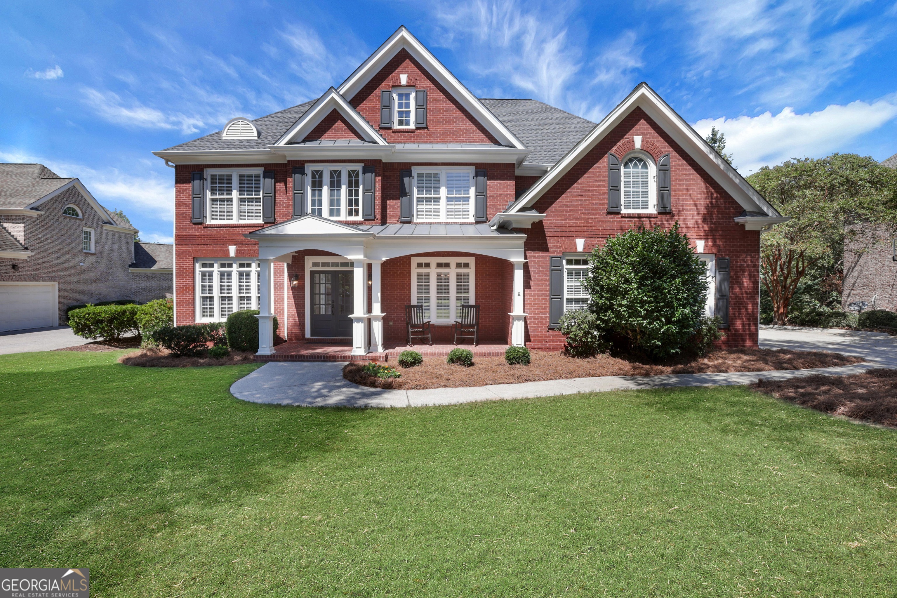 Stunning cul-de-sac home in the prestigious Grandview section of Windermere Golf & Country Club. This beautifully updated 3-sides brick home offers the perfect blend of elegance, comfort, and functionality across all three finished levels - a GREAT opportunity to be in one of Windermere's most sought-after neighborhoods. Step inside to a bright, freshly painted interior featuring a welcoming two-story family room with a wall of windows, fireplace, and custom built-ins overlooking private wooded views. The spacious main level also includes a guest bedroom with full bath, an elegant dining room, a versatile office or living room, and a gourmet kitchen with granite island open to a cozy keeping room with its own fireplace and built-ins. Upstairs, retreat to the expansive owner's suite with sitting room, spa-like bath, and an oversized custom closet. Three additional bedrooms, two full baths, and an upstairs laundry room complete the upper level. The fully finished terrace level is ideal for multi-generational living or a private apartment, offering a bedroom and full bath, kitchen, family room, game room, media room, and ample storage. Additional highlights include a 3-car garage, new carpet, and fresh interior paint. Enjoy resort-style amenities including championship golf, tennis, pickleball, swimming pools, fitness center, playgrounds, and miles of walking trails-all in one of South Forsyth's most desirable communities. This one truly has it all: a flowing layout, updated finishes, flexible spaces, and sunrise views you'll never tire of.