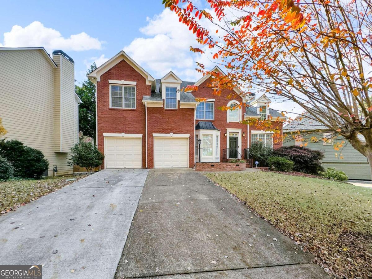 Welcome to 3195 Vickery Dr NE, a stunning 6-bedroom, 4-bathroom home in the highly desirable Vickery Park neighborhood. Ideally located just 6 miles from downtown Marietta, this property offers an exceptional blend of space, privacy, and access to top-rated Cobb County schools. Step inside to soaring ceilings and a thoughtfully designed layout that perfectly balances comfort and functionality. On the main level, you'll find a versatile bedroom that could serve as a secondary master, a formal dining room, and a dedicated office or playroom. The spacious laundry room includes cabinetry for added convenience. The kitchen stands out with its stone countertops, a breakfast bar, and a bright eat-in area, ideal for casual dining. Upstairs, retreat to the oversized master suite with a cozy sitting area, two large walk-in closets, and a spa-like ensuite complete with a jacuzzi tub, separate shower, and double vanity. Two additional bedrooms share a convenient Jack-and-Jill bathroom, each with its own walk-in closet for added storage. The fully finished basement expands your living options with two bedrooms, a full bathroom, a gym or secondary living area, and a large workshop or bonus room, offering endless possibilities for recreation or relaxation. Outside, enjoy one of the largest level lots in the neighborhood, featuring a covered patio, composite decking, a retractable awning, and lush privacy landscaping. The property also includes a sprinkler system (buyer to verify functionality). Additional upgrades include two brand-new AC units with transferable warranties and a 2-car garage equipped with cabinetry and overhead storage. With access to a vibrant community park and pool, paired with a neighborhood celebrated for its welcoming atmosphere, this home offers the perfect blend of space, comfort, and connection-an ideal choice for families or anyone craving convenience and a sense of belonging. Homes in Vickery Park rarely stay on the market, so schedule your showing today and make this exceptional property yours!
