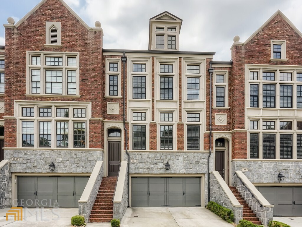 Spectacular 3 bedroom & 3.5 bath townhome in the upscale, elegant, luxury destination, Savoy at Town Brookhaven offers custom features by Renowned Designer Cecconi Simone. This exquisite 3 level home boasts of sunlight, hardwood floors, integrated appliances, home audio, linear fireplace, added office nook, large owners suite w/sitting area & spa-like bath w/kholer soaking tube, owners custom walk-in closet. Built-ins galore! The in-law suite on the terrace level is a fantastic addition. Deck on main level and a covered walk-out patio looks onto a lush green backyard. Enjoy the community pool, fireplace & grill, while being minutes away from Brookhaven's shopping and entertainment hub. This home is a true show stopper!!!