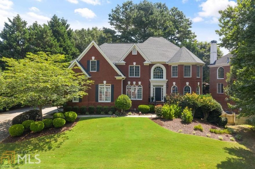 Incredible BRICK beauty with 3 CAR GARAGE, FENCED level back yard in amenity rich Sugar Mill. Quiet culdesac location!Enormous 2 story family room will accommodate the largest of family gatherings! Open kitchen, bkfst are and keeping rm. Updated interior paint colors, hardwoods throughout main. Bdrm on main. Upstairs are 4 lg bdrms, 3 baths. Newer carpet upstairs. Master suite with custom closets, renovated master bth. Bsmt features 2 large rec rooms, workshop & full bath. Level backyard, large deck. Perfect for entertaining! Top N. Fulton schools! Convenient to PIB and 141!