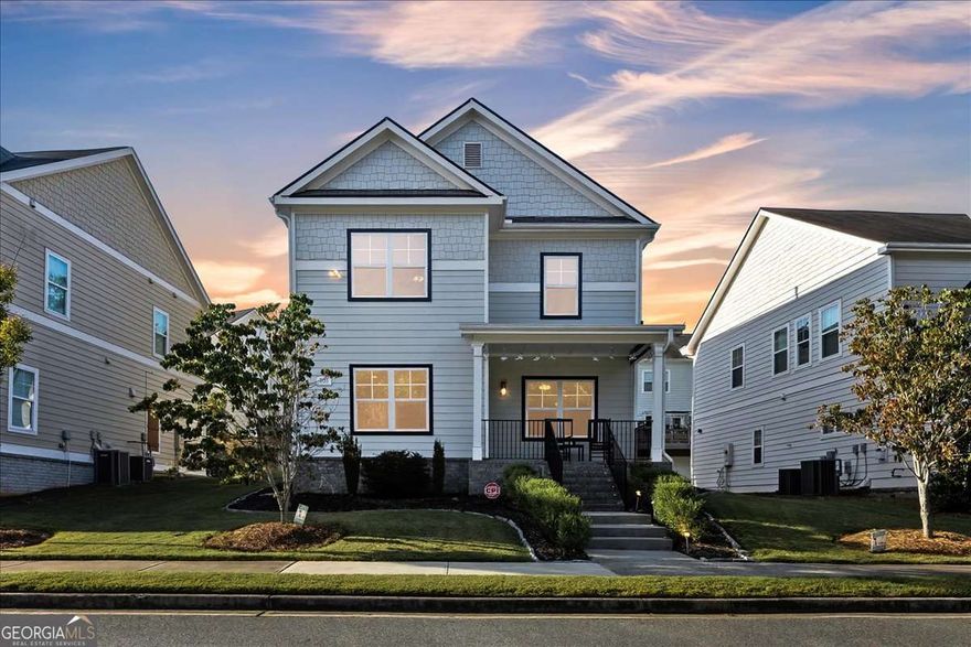 Step inside this stunning residence and be greeted by sunlight flooding the open floorplan. Soaring ceilings and gleaming hardwood floors throughout create a true sense of upscale elegance. Tinted windows allow light to pour in while maintaining privacy, creating a bright yet serene atmosphere. The gourmet kitchen is a chef's dream, featuring granite countertops, a center island with bar seating, ample cabinetry, and stainless-steel appliances. Its open layout provides a seamless view to the family room, making entertaining effortless. The family room, with its high ceilings and plentiful natural light, is the heart of the home. Perfect for cozy movie nights, lively game days, or simply relaxing with loved ones. Recessed and pendant lighting adds warmth and sets the perfect mood for any occasion. Upstairs, the grand owner's suite offers a private sitting area and a beautifully remodeled bathroom featuring a high end double vanity, freestanding tub, newly tiled floor and stand-up shower, and a spacious walk-in closet. Two additional bedrooms, a full bath, and a convenient laundry room complete the upper level. Relax on the charming covered front porch, complete with wrought iron railing, brick laid steps, and illuminated stair lighting, perfect for sipping morning coffee, reading a book, or enjoying crisp fall evenings surrounded by the tranquility of nature. The versatile two-car garage features a retractable screen with a convenient passage door, making it perfect for a home gym, art studio, or workshop. Enjoy all the functionality without the intrusion of bugs. Enjoy peace of mind knowing the roof, water heater, and HVAC are only six years old. Located just minutes from the vibrant Marietta Square, offering a variety of restaurants, breweries, festivals, concerts, and seasonal celebrations. The Battery and Truist Park are close by, providing an unmatched sports and entertainment experience. Outdoor enthusiasts will appreciate nearby Kennesaw Mountain, with its scenic hiking, biking, and walking trails. With easy access to Cobb Parkway and I-75, commuting is effortless. This pristine home in an incredible location at an exceptional price is a rare find. All it's missing is you!