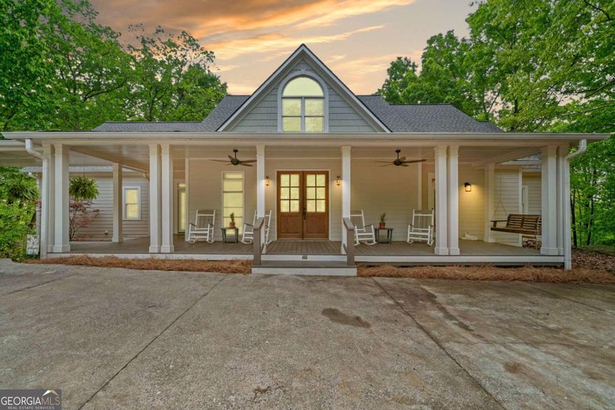 Welcome to Your Southern Retreat in Lake Arrowhead    This charming Southern home has been beautifully updated. It invites you to relax, enjoy gatherings, and make wonderful memories. Located in Lake Arrowhead, it offers seasonal lake views. It's ideal for lazy Sundays, telling stories on the porch, and enjoying time with loved ones.    As you enter through the oversized double doors, you'll feel at home in the warm, inviting entry that sets the tone for the rest of the house. Hardwood floors flow throughout the main level, where the primary suite and a guest bedroom offer peaceful retreats. The primary bathroom is a serene escape, complete with a slipper soaking tub, separate shower, and double vanities.    The kitchen has granite countertops and stainless steel appliances. It connects smoothly to the living and dining areas. This design is great for entertaining or relaxing at home.    The finished basement downstairs has many possibilities. It features its own kitchen, a full bath, and a roomy living area. There are also extra bedrooms. This space is great for guests, hobbies, or multi-generational living. Seller is willing to negotiate a concession for painting the upstairs and the basement.   Step outside to sip your morning coffee or relax in the evening. The screened porch and deck both provide stunning views of the lake and the changing landscape. The front porch is ready for rocking chairs and a swing. Bring yours and settle in.    The circular driveway welcomes you warmly. The detached double garage offers plenty of storage and easy access. A covered walkway connects it to the main house, making it convenient in any weather.   This is more than a house. It's a Southern home where life slows down, and the moments that matter most take center stage.  Lake Arrowhead offers a championship golf course, clubhouse, restaurant, 2 pools, tennis, parks, courts, hiking trails, and one of GA's cleanest lakes! Gated security makes this resort community ideal for a 1st or 2nd home. Approximately 15-20 minutes from charming downtown Canton!