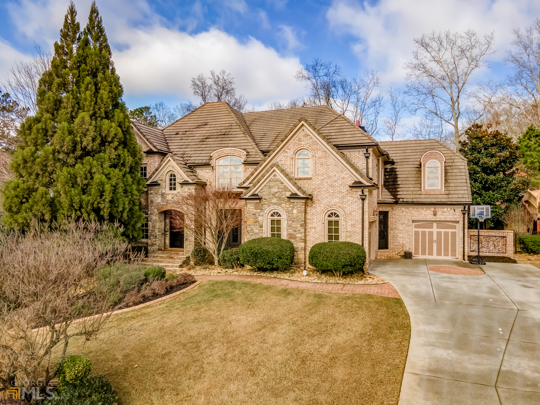 *This home offers an extensive list of luxurious features. Starting with the double, wrought iron doors that welcome you into a two-story foyer. Cherry, hardwood floors grace both the 1st and 2nd floors. *A formal study and dining room flank the foyer. 10' ceilings, 8' foot doors and extensive moldings provide the luxurious elegance you deserve. *A gourmet kitchen is equipped with professional Subzero and Wolf appliances, custom wood cabinets, and a hidden walk-in pantry. The keeping room with wood burning fireplace & built-in bookcases is the ideal place to relax with a cup of coffee and good book. *The elegant great room features coffered ceiling moldings, an oversized wood burning fireplace and a beautiful, curved wall of windows. *The master bedroom features cherry hardwood flooring, gas log fireplace and sitting area. *The terrace level is designed for entertaining. An open floor plan allows the guest to enjoy the billiard room, custom bar area, and theater room. The bar is equipped with two dishwashers, beverage cooler, pull out beverage drawer, ice maker & sink. *OrkinTherm insulation provides pest mgmt, Ring camera security, & Nest thermostats. The lighting, security cameras, and sound system can all be accessed through your phone using SMART systems. *The backyard features a kitchen with wood-burning fireplace, area for large TV, outdoor speakers. Inground, heated, Pebbletec pool with lighting, jacuzzi and waterfall. Firepit area. Playground terrace. Fenced yard. *Ideally located with easy access to downtown Roswell, historic Marietta, or downtown Atlanta. Some of the best restaurants and shopping (not to mention interstate highway access) within minutes of your home. Cul-de-sac lot with wooded privacy.