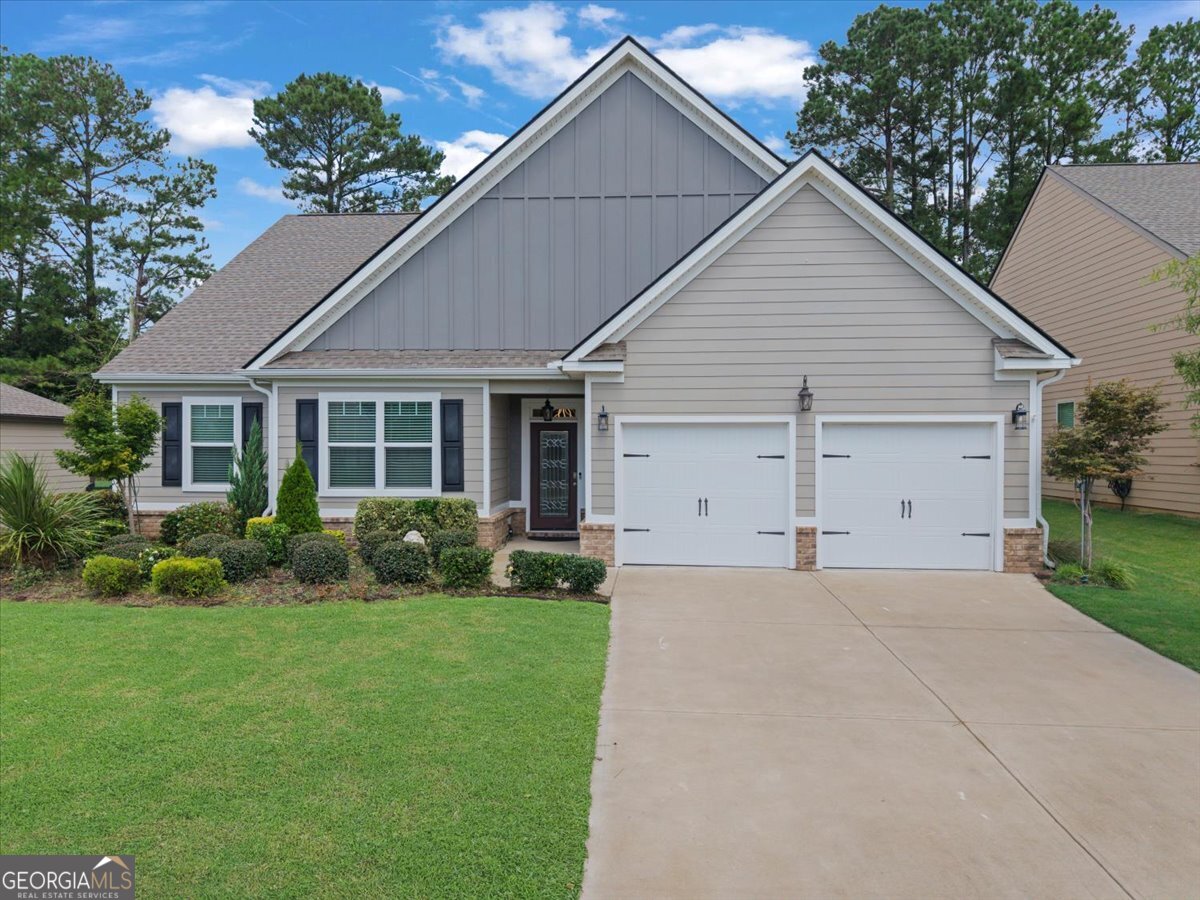 Charming craftsman 4BR/2BA in the only gated community in town with swim & tennis! Inside, the open floor plan flows seamlessly, complemented by thoughtful homeowner updates. Enjoy year round living in the new all weather sun porch, cook and entertain with ease on the grilling deck, & take advantage of additional cabinet storage that enhances both style & functionality. Extensive landscaping with lighting, and HOA that keeps the neighborhood cohesive-no driveway/street parking. Just 2 miles to I-20 for an easy commute! Inside, the open floor plan provides a warm, inviting flow that's perfect for everyday living or entertaining. Outside, the home is enhanced by extensive landscaping and accent lighting, adding charm and elegance day and night. Rare opportunity with unmatched amenities.