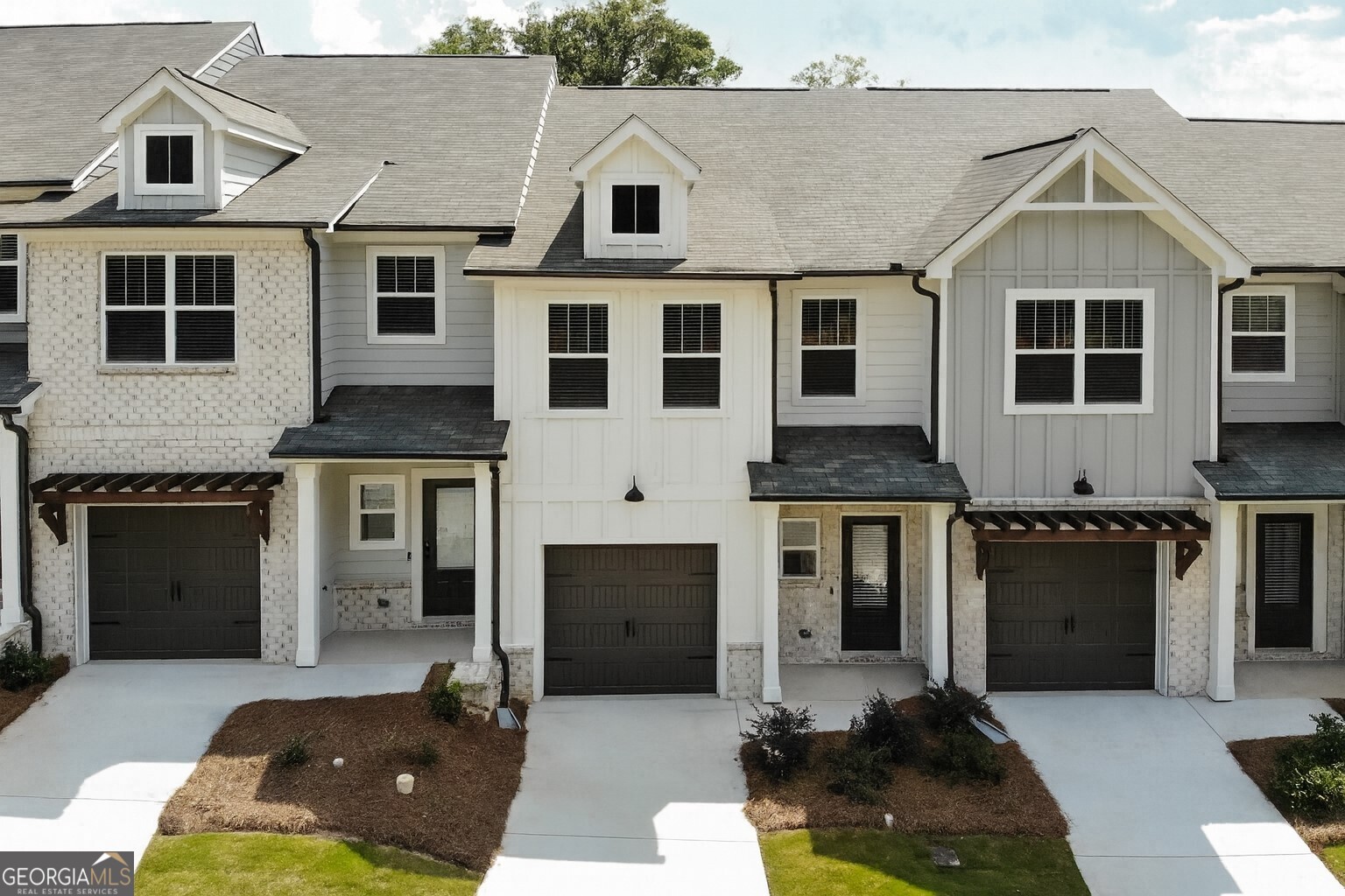 The Willow plan built by Create Homes. Quick Move-In! Enjoy the convenience of prime location close to shopping, dining, Hartsfield-Jackson International Airport, I-285, I-20, I-75 and the East-West Connector. Within walking distance to vibrant downtown Austell, this stunning new residence seamlessly blends contemporary style with functional living, creating a space that elevates your everyday. Enter into the open-concept main level which offers a modern kitchen featuring stylish countertops, stainless steel appliances, a spacious island, and soft-close cabinets and drawers. This space seamlessly flows into the dining and living areas, making it ideal for both everyday living and entertaining. A private rear patio extends your living space, providing a great spot to unwind and enjoy the outdoors. Upstairs you'll find the primary suite offers a spacious retreat with a double vanity, a walk-in closet, and modern hardware and fixtures for a sleek, contemporary feel. The laundry room is conveniently located nearby, and two secondary bedrooms with a full bath completes this floor. Built by Create Homes, this energy-efficient townhome features smart home technology and quality construction. Ask us about our up to $5,000 towards closing costs or options incentive*. Must use Seller's Preferred Lender with binding contract by 09/30/2025 and close by 10/30/2025. Secondary photos are of the standing Model Home, listing color selections vary. Kitchen and Master Bath are of the actual home.
