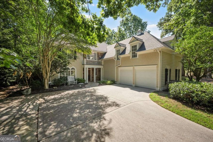 Nestled on a serene cul-de-sac in the sought-after Spalding Heights neighborhood, this beautifully renovated home sits on a lush, private 0.8-acre lot that feels like a tranquil retreat!  Upon entering, you're greeted by soaring high ceilings and gleaming wide-plank hardwood floors. Fresh paint and modern lighting add a crisp, inviting ambiance throughout.  The heart of the home, the kitchen, includes a spacious island, breakfast bar, pantry, and a sunny breakfast nook adjacent to a cozy keeping room-perfect for casual gatherings or morning coffee.  The two-story foyer leads into a grand great room with a coffered ceiling, where large windows offer scenic views and abundant natural light. Step through sliding doors to the screened porch and flagstone patio-ideal for entertaining or quiet relaxation. A charming terraced waterfall flows into a koi pond, adding a touch of serenity to the backyard oasis.  A versatile bedroom/office with an adjacent full bath on the main level offers both flexibility & comfort-perfect for guests!  Upstairs, the Primary Suite is a private sanctuary, featuring a tray ceiling, sitting area, spa-like bath with dual quartz vanities, a soaking tub, roomy shower, and an expansive walk-in closet.  Three additional bedrooms and two upgraded baths complete the upper level.  Outside, the fully fenced backyard features a Japanese garden, mature landscaping, and a generous level area perfect for a fire pit, play set, or simply enjoying time outdoors.  This home's prime Sandy Springs location offers both tranquility and convenience. It's just minutes from Dunwoody Country Club and nearby shopping and dining options, providing the perfect blend of suburban peace and city-side amenities.  This gem offers an exceptional opportunity to own a captivating and thoughtfully updated residence that perfectly balances indoor elegance with outdoor charm. Ideal for entertainers or anyone seeking a serene sanctuary with modern comforts and effortless access to the best of Sandy Springs!