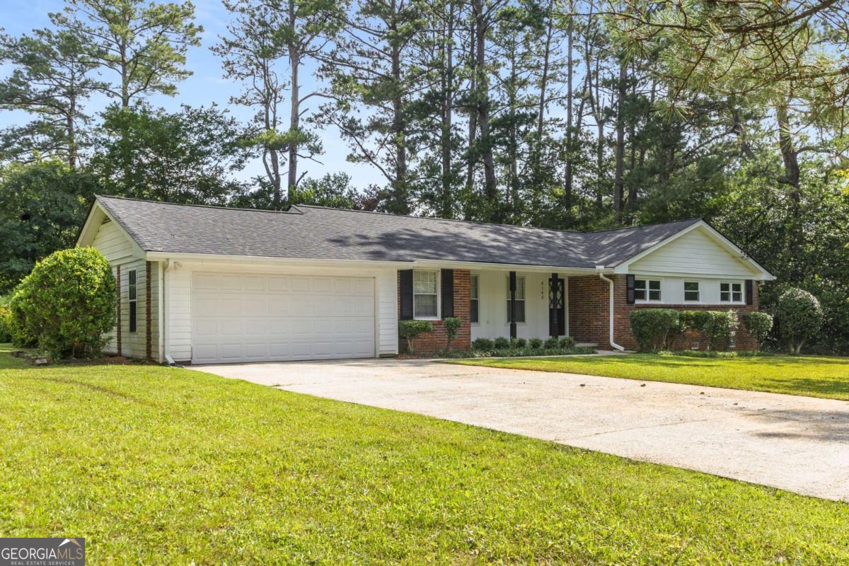 Welcome to your new home in the heart of Stone Mountain! For qualified buyers, we have 1% down loans and $2,500 in closing costs with our preferred lender! We also have an additional 4th of July special with $4,000 in sellers paid closing cost if under contract by 7/12! Call, text, or email for more details. This beautifully updated 4-bedroom, 2-bathroom ranch offers single-level living at its finest, making it ideal for any stage of life. It has been exceptionally maintained boasting newly refinished hardwood floors throughout, a brand-new roof, updated HVAC system, new windows, brand new electrical panel, re-done crawlspace water proofing, and modern appliances. The kitchen features elegant granite countertops, and the bathrooms have been tastefully updated to provide a fresh feel. The oversized windows throughout the home give it an open and airy feel. Situated on a large, level lot, the expansive backyard offers endless possibilities for outdoor activities and gardening enthusiasts. The home's prime location provides easy access to public transportation and is just a stone's throw away from downtown Decatur, known for its vibrant scene with over 80 restaurants and pubs. Nature lovers will appreciate the proximity to Stone Mountain Park, Georgia's most visited attraction, spanning 3,200 acres of natural beauty. The park offers a variety of outdoor recreational activities, seasonal family-friendly attractions, and breathtaking natural and historical sites. Additionally, the renowned DeKalb Farmers Market is nearby, offering a vast selection of fresh produce, meats, and seafood since 1977. For those pursuing their education, Georgia State University's Perimeter College Clarkston Campus is conveniently close, making this home an excellent choice for students, faculty, or staff. Whether you're a first-time homebuyer, a growing family, or looking to downsize, this move-in-ready home combines modern updates with a prime location. Don't miss the opportunity to make this charming property your own!