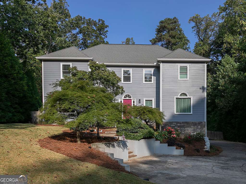 Welcome to your dream home in the highly coveted Old Paper Mill neighborhood, where luxury, comfort, and community come together in one perfect package. Just a short walk to the scenic Sope Creek National Park trails and located in the award-winning Sope Creek Elementary School district, this home offers both prestige and convenience. The chef's kitchen is the heart of the home and designed for those who love to cook and entertain. Enjoy the NXR PRO Series Gas Range with six German dual-power burners (90,000 BTUs total), GE Profile 27" built-in combination convection microwave and wall oven, slate cabinetry, and commercial vent hood. A chic wet bar off the foyer adds a stylish touch, making hosting effortless. The upstairs primary suite is a private retreat, featuring a spa-inspired bath with soaking tub, oversized shower with basketweave marble tile, and luxurious finishes. Upstairs laundry means convenience is built into daily living. The finished basement adds versatility with a full bathroom, creating the perfect space for guests, recreation, or a home office. This home has been beautifully updated with newer Low-E double-pane windows and doors, newer roof and gutters. Step outside and escape to your own resort-style backyard oasis. The fully fenced outdoor space is built for fun and relaxation with an awesome heated saltwater POOL, playground and cedar pergola. Whether you're entertaining friends or enjoying a quiet evening at home, this backyard has it all. Old Paper Mill offers more than just a great location-it's a lifestyle. The HOA includes swim and tennis, giving you access to top-tier amenities and a welcoming community. With convenient access to I-75 and I-285, you'll enjoy an easy commute while living just minutes from shopping, dining, and recreation. This home is the complete package: luxury finishes, thoughtful updates, resort-style outdoor living, and one of East Cobb's most desirable neighborhoods. Don't miss the opportunity to make it yours!