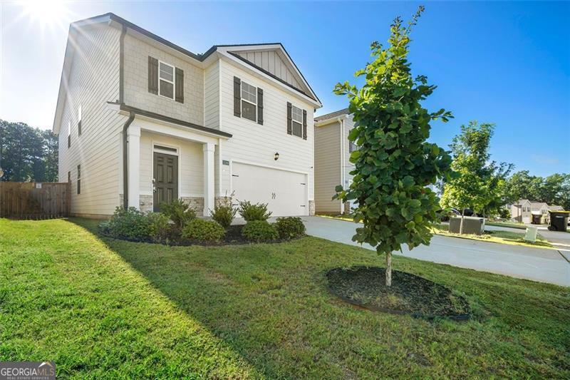 This like-new 5-bedroom, 3-bathroom home is a prime opportunity in a gated, craftsman-style community! Featuring luxury flooring, a bright open layout, an oversized owner's suite, private fenced patio, and a main-level guest suite, it's ideal for growing families or remote work living. Enjoy a warm upstairs loft, stainless steel appliances, and room to thrive in a community with 80 more homes coming soon. Don't miss out. Live now and build equity as the community develops! Available for sale or lease.