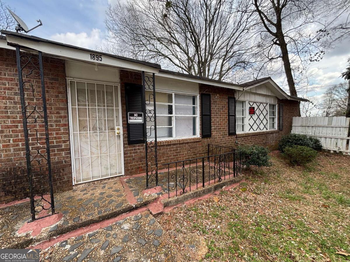 Calling All Investors! Fix & Flip Goldmine in Thomasville Heights. Major price reduction! Priced to sell and offered As-Is. This four-sided brick with unfinished partial basement beauty sits on nearly half an acre of LEVEL, clear buildable land. A rare gem inside the city limits. Incredible opportunity tucked into a quiet, established neighborhood in the heart of Atlanta. Seller added one bedroom and one full bath addition, (in tax records it is a 3/1) also has partial unfinished basement, and newer HVAC and water heater, the bones are solid and the potential is sky-high. Zoned R-4, there's even the possibility of adding a 1-bedroom ADU out back for extra rental income. Driveways on BOTH sides of the property. An investors dream. Located just 7 miles from Hartsfield-Jackson Airport and minutes to Lakewood Amphitheatre, this property offers prime access to major Atlanta attractions. Bring your vision and your toolbox to this fixer upper is being sold as-is, but the upside? Limitless Big lot. Brick shell. Bold opportunity. Don't miss this one. Agents please see private remarks for offer info.