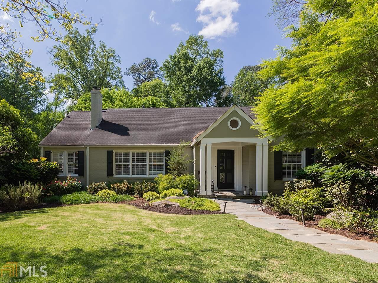 This exceptionally large, tastefully renovated Garden Hills home sits on a deep, lush lot!  Your dream kitchen awaits with double oven & 6 burner Dacor appliances, wine fridge, built-out pantry, white raised panel cabinetry, oversized island all opening to a screened back porch and family room.  This home has great flow and is perfect for entertaining. Incredible master suite with walk-in closet and white marble bathroom.A true guest suite on the main level is a rare find. Hardwood floors throughout.  Bonus media/play room, sunroom, finished basement, extra guest room offer lots of options to work from home and/or have separate play spaces.  Large daylight basement with laundry room and enormous garage.  This property offers year round outdoor living.  Enjoy cool fall nights around your stone firepit or dine on your back deck in the spring and enjoy summer nights from your screened porch. This home is equipped with a double rain barrel, pumped irrigation system. Tons of off street parking and good walkability to Garden Hills Pool & more!  DonG??t miss this!