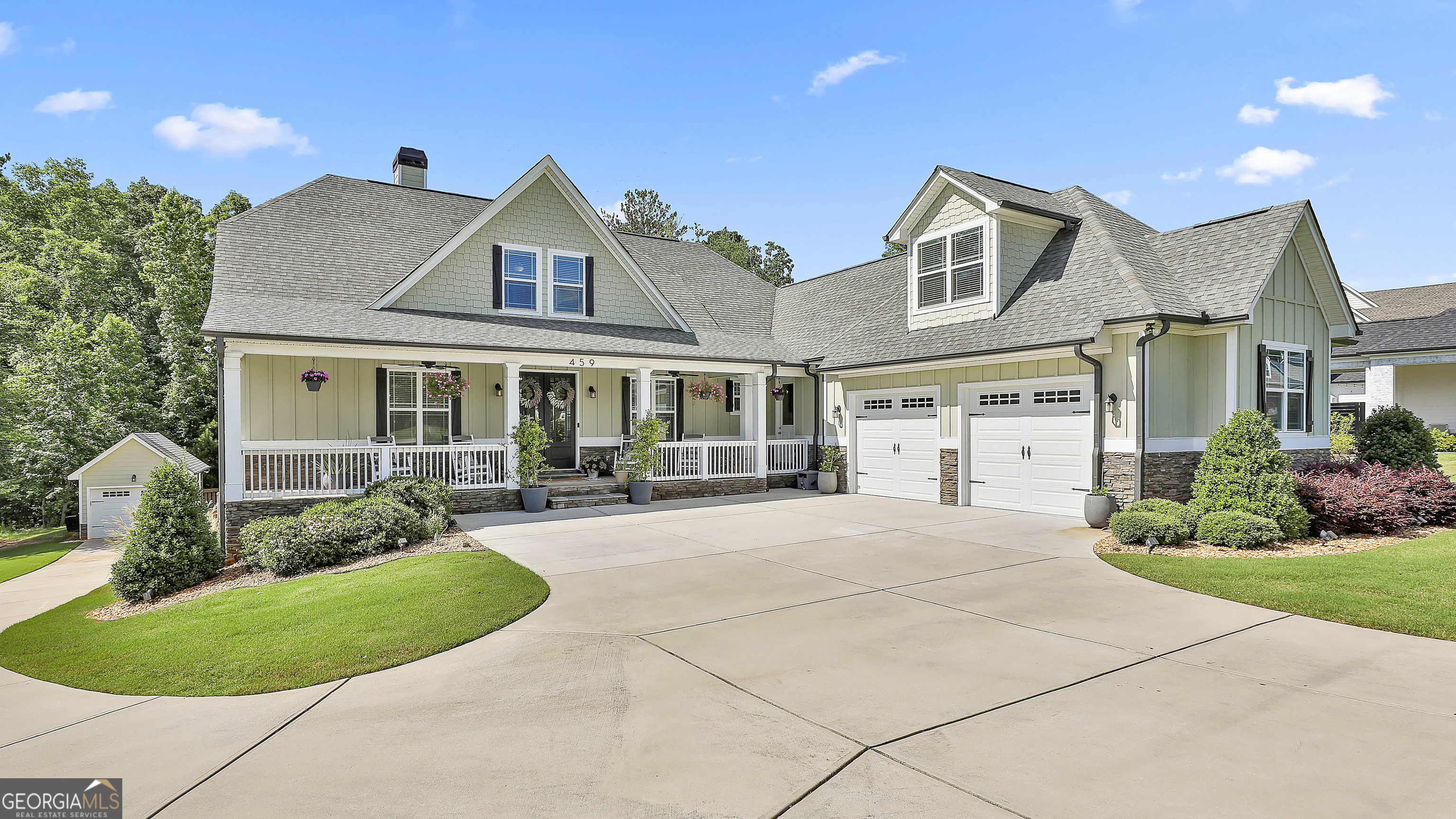 Experience luxury living in this stunning 7-bedroom, 5-bath home nestled in the prestigious Northshore subdivision of Lake Redwine in beautiful Coweta County. This expansive residence offers an unmatched combination of elegance, comfort, and thoughtful design, with room for everyone and every occasion. From the moment you arrive, you're welcomed by a large driveway with additional parking, an oversized 2-car garage, plus a separate detached garage with full electricity-ideal for a workshop, storage, or hobby space. Inside, you'll be captivated by the open floor plan, featuring a well-appointed kitchen with abundant cabinetry, high-end appliances, and a center island perfect for gathering. The sunroom offers a bright and peaceful retreat, while the natural gas fireplace adds warmth and charm to the main living area. Enjoy added peace of mind and convenience with WiFi-enabled smart locks, a natural gas tankless hot water heater, and a full irrigation system for easy outdoor maintenance. The main level also includes generously sized bedrooms and elegant baths, while the lower level boasts an entire separate finished living area with its own full kitchen, including two bedrooms and two bathrooms ideal for an in-law suite or additional living quarters for guest or growing families. Upstairs, take in lake views from the spacious bonus room, adding a serene touch to the already impressive layout. Step outside to your private backyard oasis, complete with a fenced saltwater gunite pool perfect for relaxing and entertaining year-round. The beautifully landscaped yard is ideal for gatherings, pets, or simply enjoying your surroundings in this peaceful lake community. This is more than just a home-it's a lifestyle. Residents of Lake Redwine enjoy exclusive lake access, walking trails, community amenities, and proximity to shopping and dining. With over 5400 square feet of thoughtfully crafted living space, this home is perfect for living, entertaining, and enjoying all that Lake Redwine has to offer. Don't miss this rare opportunity to own one of the most exceptional properties in the community! Call The Charles Davis Team to get more information and schedule a showing!