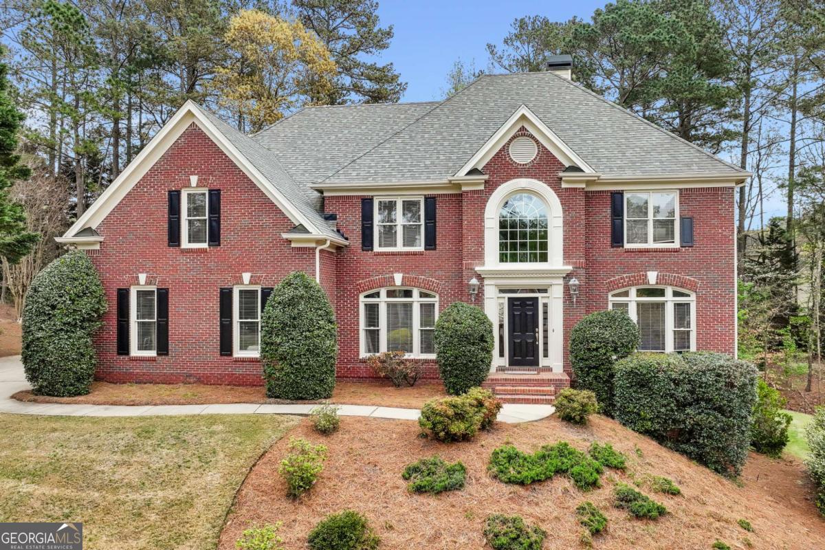 3 Car Garage, 3 Sides Brick in Fabulous Sugar Mill! Amazing Backyard - Level, Private and Features a Beautiful Firepit and Seating area! NEW Deck overlooks it all! Fresh Exterior Paint! Bedroom and Full Bath on Main! Basement with Full Bath!