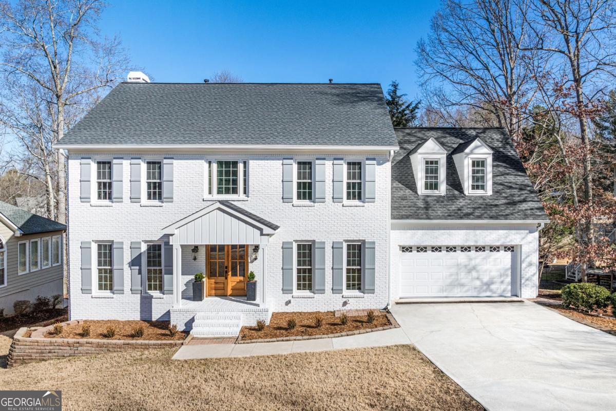Welcome to Your Dream Home in East Cobb's Sought After Lassiter High School District! Nestled in a tight-knit, family friendly neighborhood, it sits directly across from the neighborhood pool and tennis courts an ideal setting for building lifelong connections. From the moment you step inside the 6-bedroom, 5.5-bathroom home, you'll be captivated by the open and airy floor plan, illuminated by stunning Restoration Hardware chandeliers, including an eye catching statement piece in the entryway. The main level exudes warmth and sophistication, featuring a newly installed stone fireplace. Designed for both function and style, the kitchen is an entertainer's dream, boasting an oversized island, high-end hardware, a pot filler faucet, and a generously sized walk-in pantry for effortless meal prep. Step outside to the expansive newly finished deck, perfect for hosting gatherings or enjoying peaceful mornings overlooking the large, level, and fenced in backyard an ideal space for kids, pets, or outdoor entertaining. The primary suite is a true sanctuary, complete with a custom designed walk-in closet featuring ample shelving and storage. The spa like ensuite bathroom offers double sinks, a stunning walk-in shower, a large soaking bathtub, and a sleek modern LED mirror, all designed to enhance your daily routine. Upstairs, you'll find three additional spacious bedrooms, each paired with beautifully renovated bathrooms. Every window in the home is brand new, flooding the interior with natural light. The finished basement is perfect for guests or multi generational living, featuring a large open floor plan, two additional bedrooms, and two full bathrooms and a kitchenette or bar for added entertainment space. All crafted with the same high end finishes as the rest of the home. Step outside from the basement to a charming patio leading to the beautifully fenced in backyard. Additional updates include: BRAND-NEW WHITE BRICK EXTERIOR WITH BRAND NEW SIDING AND A NEW ROOF NEW HARDWOOD FLOORS THROUGHOUT NEW DOORS, STAIRS, AND FRESH PAINT THROUGHOUT NEWLY INSTALLED BASEMENT STAIRCASE FOR EASY ACCESS With everything inside and out brand new, this home is truly move-in ready. Located in one of East Cobb's most desirable communities, it offers the perfect blend of luxury, comfort, and community. Schedule your tour today and experience this exceptional home for yourself!