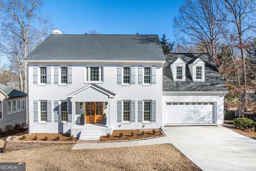 Welcome to Your Dream Home in East Cobb's Sought After Lassiter High School District! Nestled in a tight-knit, family friendly neighborhood, it sits directly across from the neighborhood pool and tennis courts an ideal setting for building lifelong connections. From the moment you step inside the 6-bedroom, 5.5-bathroom home, you'll be captivated by the open and airy floor plan, illuminated by stunning Restoration Hardware chandeliers, including an eye catching statement piece in the entryway. The main level exudes warmth and sophistication, featuring a newly installed stone fireplace. Designed for both function and style, the kitchen is an entertainer's dream, boasting an oversized island, high-end hardware, a pot filler faucet, and a generously sized walk-in pantry for effortless meal prep. Step outside to the expansive newly finished deck, perfect for hosting gatherings or enjoying peaceful mornings overlooking the large, level, and fenced in backyard an ideal space for kids, pets, or outdoor entertaining. The primary suite is a true sanctuary, complete with a custom designed walk-in closet featuring ample shelving and storage. The spa like ensuite bathroom offers double sinks, a stunning walk-in shower, a large soaking bathtub, and a sleek modern LED mirror, all designed to enhance your daily routine. Upstairs, you'll find three additional spacious bedrooms, each paired with beautifully renovated bathrooms. Every window in the home is brand new, flooding the interior with natural light. The finished basement is perfect for guests or multi generational living, featuring a large open floor plan, two additional bedrooms, and two full bathrooms and a kitchenette or bar for added entertainment space. All crafted with the same high end finishes as the rest of the home. Step outside from the basement to a charming patio leading to the beautifully fenced in backyard. Additional updates include: BRAND-NEW WHITE BRICK EXTERIOR WITH BRAND NEW SIDING AND A NEW ROOF NEW HARDWOOD FLOORS THROUGHOUT NEW DOORS, STAIRS, AND FRESH PAINT THROUGHOUT NEWLY INSTALLED BASEMENT STAIRCASE FOR EASY ACCESS With everything inside and out brand new, this home is truly move-in ready. Located in one of East Cobb's most desirable communities, it offers the perfect blend of luxury, comfort, and community. Schedule your tour today and experience this exceptional home for yourself!