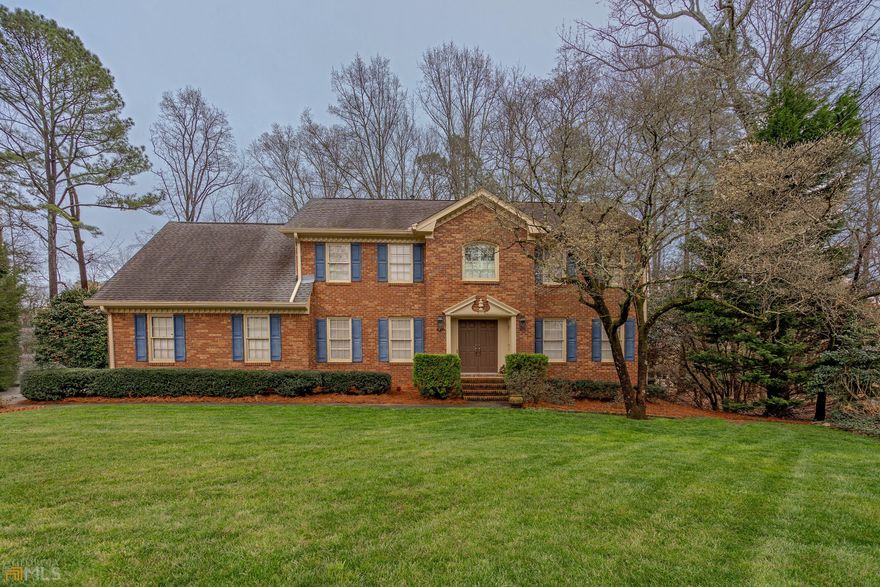 Beautiful Updated All Brick Home Situated in a Lovely Picturesque Setting and on a Level Cul-de-Sac Lot in the Popular Swim/Tennis Neighborhood of Spalding Corners! Located in the award-winning Simpson Elementary School district, this very well-maintained home features spacious rooms, some hardwood floors on main, wooden blinds, neutral colors, and recessed lighting. Entry foyer opens to formal living room and dining room with wainscoting. The beamed family room has a brick fireplace, wet bar and built-ins. Updated kitchen with cherry cabinetry, stainless steel appliances including a Wolf gas cooktop, convection oven, microwave with convection feature, instant hot water dispenser, granite countertops with breakfast bar, prep island, under-counter lighting, and bright breakfast room bay. Walk out to deck overlooking expansive, private backyard, perfect for grilling, entertaining and family life! Laundry room and half bath round out the main level. Upper level includes owner's suite with quartz vanity and walk-in shower. Three secondary bedrooms with hall bath. Large bonus room great for office, media room or playroom! Full unfinished daylight walk-out terrace level, great for expansion or storage. 2 car side entry garage. Optional HOA membership with Olympic Sized Pool, four lighted tennis courts, playground and volleyball court! Fantastic location close to shopping, dining, top rated private and public schools including the new Paul Duke Stem School, The Forum, Town Center, area parks and trails. Welcome Home!