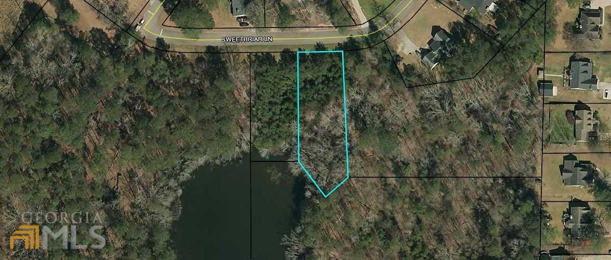 Lake front lot in established subdivision. Only one of two lake lots in the subdivision ever offered for sale. All city utilities. Minimum heated area and other restrictions apply. This lot is inside city limits of Griffin.