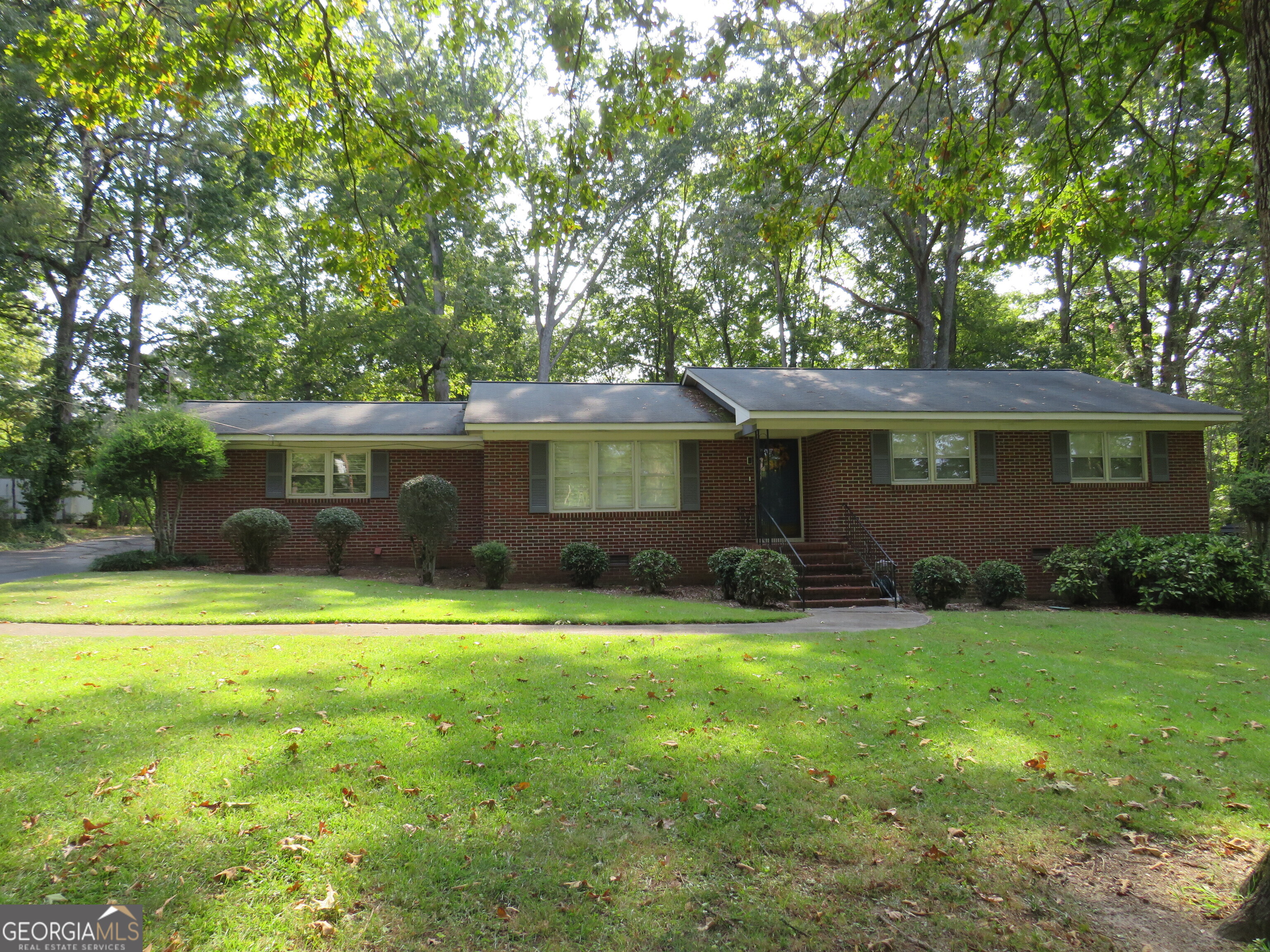 Location, location, location! This brick ranch sits in the perfect area. North end of town, convenient to Rome and Cave Spring, and downtown Cedartown. 3 bedrooms, 1.5 baths, mainly hardwood flooring, formal living and dining area, as well as den/sunroom. Private backyard with small fenced area perfect for small children or pets. Additional carport and storage building round out this great property. You do not want to miss this one!
