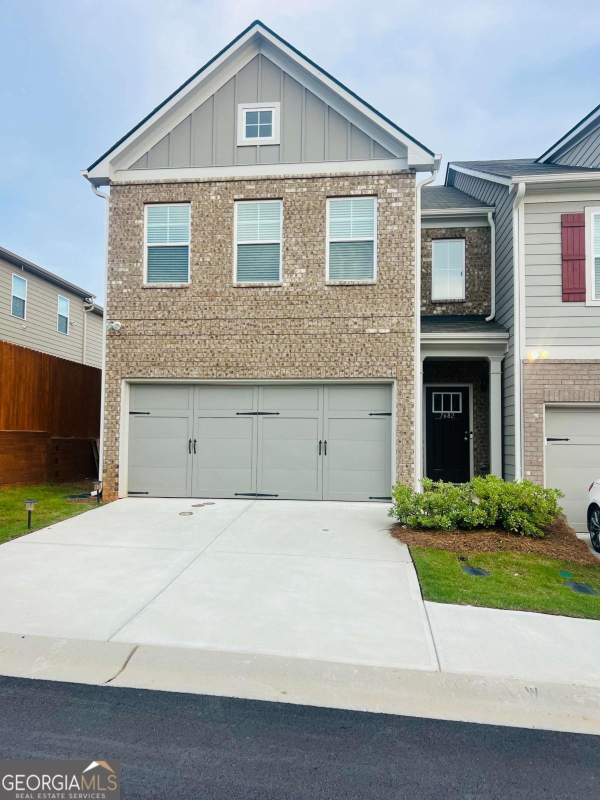 This "END UNIT" Crestwood floorplan is one of the most popular plans in the community ..... known for its bright, open layoout, huge upper level loft , coffered ceilings, decorative columns and french doors leading to the primary bedroom. This 3 bedrooms, 2 1/2 bath +Loft and 2 Car Garage is "like new" and is beautifully maintained. Step inside this airy open-concept main level featuring upgraded flooring, elegant lighting, and a charming decorative fireplace-perfect for cozy evenings or entertaining guests. The expansive kitchen, with light grey cabinetry, coordinated countertops and stainless steel appliances flows seamlessly into the dining and living areas, creating the perfect space for everyday living and gatherings. This light-filled Open Floor Plan is well thoughout. Upstairs, a versatile loft offers the ideal flex space for a home office, media area, or playroom. Retreat to the luxurious primary suite through the french doors and enjoy a spa-like bath with a walk-in shower, separate soaking tub, and a huge walk-in closet with plenty of storage. The upper level laundry room is perfectly located, allowing easy access from all bedrooms. Ceiling fans throughout and an upgraded lighting package elevate the home's comfort and style. The community has its perks - Convenient location, Swimming pool, Tennis courts, Sidewalks and just a short drive to Atlanta Hartsfield Airport, easy access to shopping, dining, parks and major highways. Don't miss your chance to own this exceptional home in one of the area's most desirable townhome communities. Schedule your showing today!