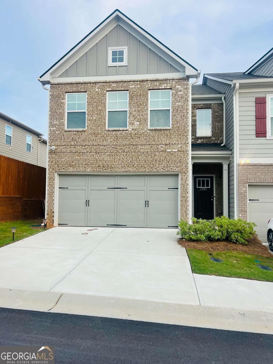 This "END UNIT" Crestwood floorplan is one of the most popular plans in the community ..... known for its bright, open layoout, huge upper level loft , coffered ceilings, decorative columns and french doors leading to the primary bedroom.  This 3 bedrooms, 2 1/2 bath +Loft and 2 Car Garage is "like new" and is beautifully maintained. Step inside this airy open-concept main level featuring upgraded flooring, elegant lighting, and a charming decorative fireplace-perfect for cozy evenings or entertaining guests. The expansive kitchen, with light grey cabinetry, coordinated countertops and stainless steel appliances flows seamlessly into the dining and living areas, creating the perfect space for everyday living and gatherings. This light-filled Open Floor Plan is well thoughout. Upstairs, a versatile loft offers the ideal flex space for a home office, media area, or playroom. Retreat to the luxurious primary suite through the french doors and enjoy a spa-like bath with a walk-in shower, separate soaking tub, and a huge walk-in closet with plenty of storage. The upper level laundry room is perfectly located, allowing easy access from all bedrooms. Ceiling fans throughout and an upgraded lighting package elevate the home's comfort and style. The community has its perks - Convenient location, Swimming pool, Tennis courts, Sidewalks and just a short drive to Atlanta Hartsfield Airport, easy access to shopping, dining, parks and major highways. Don't miss your chance to own this exceptional home in one of the area's most desirable townhome communities. Schedule your showing today!