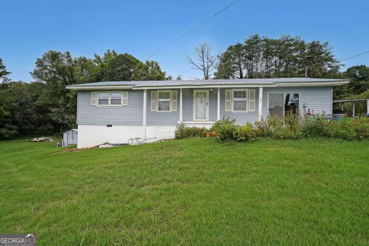 Welcome to 401 Springdale Road in Rockmart, a property with potential and important updates already in place. This 3-bedroom, 1.5-bath home offers 1,488 square feet of living space with a newer HVAC system installed in 2022 and a roof that's only five years old. The solid structure and functional layout make it ideal for someone looking to customize and add their own finishing touches. With convenient access to schools, shopping, and community amenities, this home blends small-town charm with investment potential. Sold as-is, it's a great opportunity to create value in a desirable Polk County location.