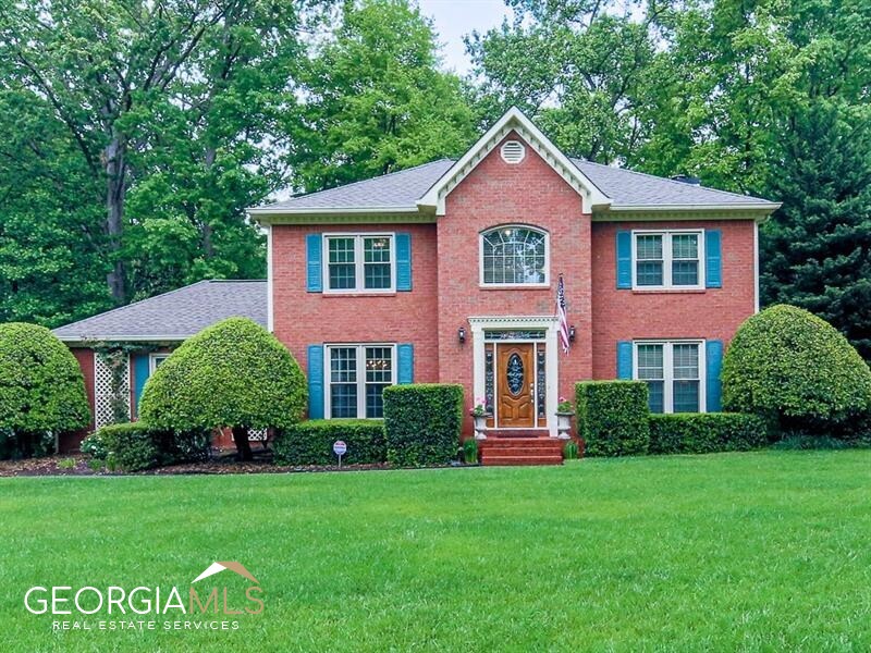 Spacious John Weiland built home in beautiful Lansdowne's Swim and Tennis Community. East Cobb Schools of Excellence. This well- loved brick front traditional boasts a private backyard with screened porch where you will enjoy your morning coffee and watch a colorful variety of birds. The main level has gleaming, recently refinished hardwood floors. The kitchen has plenty of cabinets and leads to a fireside family room with built-in bookshelves. The current owners have converted the formal living room into a sizable bedroom by adding a full bathroom to the main level. The entire 2nd level has recently replaced LVP flooring. The upstairs owners suite has trey ceilings, a large walk-in closet and an ensuite bathroom with vaulted ceilings and an oversized soaking tub and separate shower. The laundry is conveniently situated upstairs near the bedrooms. The secondary bedrooms have ample closet space. 30 year architectural shingle roof. All of the windows have been replaced, Main circuit panel replaced. No Polybutylene and water main line replaced. HVAC recently replaced. Carefree Vinyl Siding. Such a tremendous value! This beauty is ready for your customized finishing touches. Situated in desirable East Cobb - easy commute, minutes to the Interstate. Close to shopping, dining and entertainment.