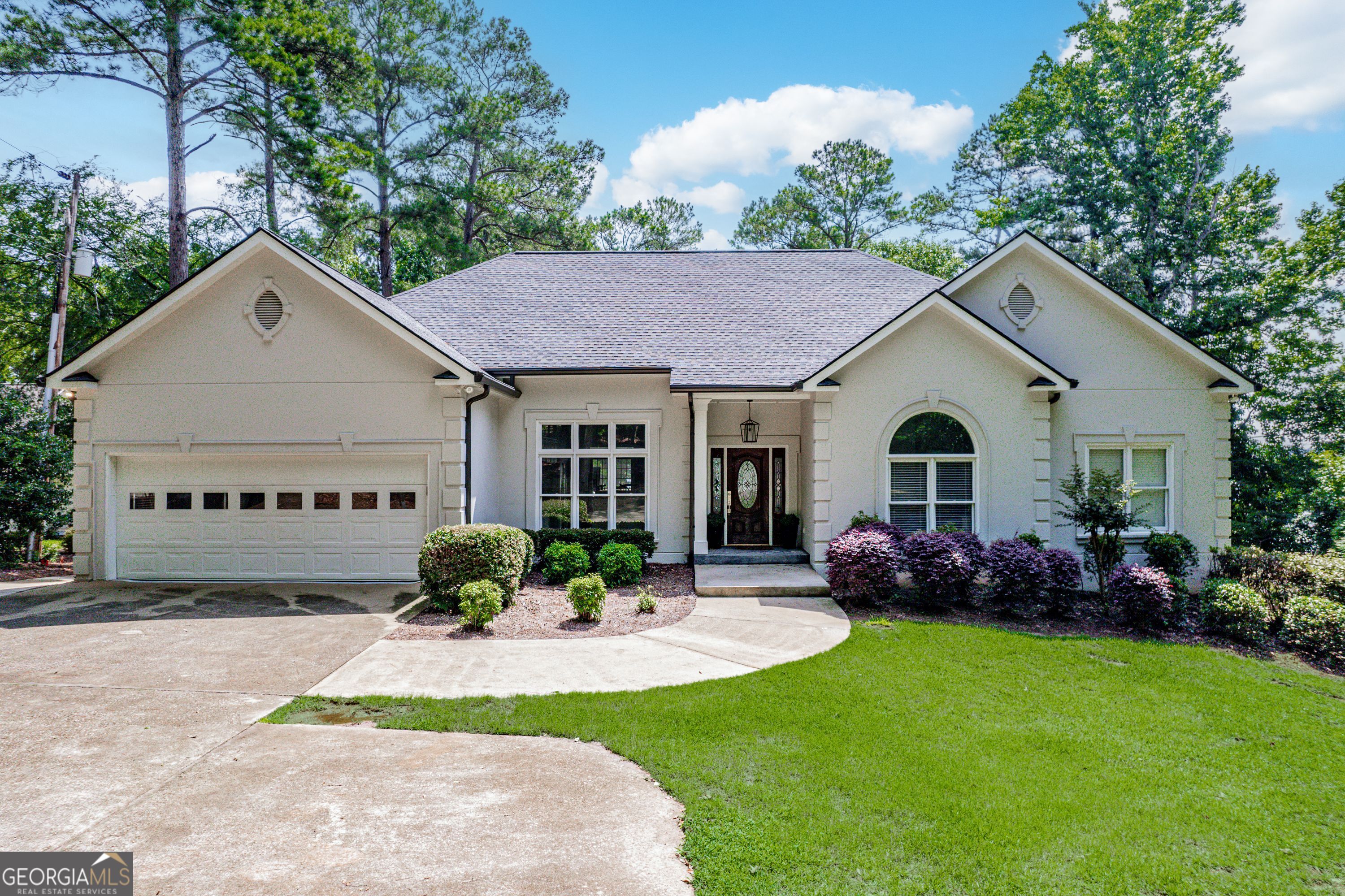 REMODELED LAKEFRONT 6 BEDROOM HOME AND ONE OF THE BEST LOTS ON LAKE OCONEE! Bring your family and friends to this spacious and open floor plan remodeled/updated home. Located on the south end of the lake on a fabulous point lot with sweeping southern exposure views and privacy. Main floor features a large living area, hardwood floors, fireplace, custom kitchen with granite countertops and stainless-steel appliances, master on the main with lake views, plus 3 additional bedrooms. The living area leads out to a wonderful, screened porch and deck facing the lake. Fully finished basement with large family room, fireplace, second kitchen, 2 bedrooms with lake views, a custom bunk bedroom, and a large patio. The kitchens/bathrooms and interior have been perfectly remodeled. The perfect home and lot for maximum enjoyment of the lake!