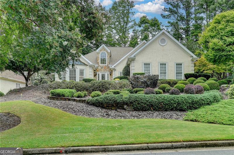 Come tour this beautifully maintained 3-bedroom, 2.5-bath hard-coat stucco ranch home located in the highly sought-after Medlock Bridge Subdivision. Just a short walk from both top-rated Johns Creek High School and Medlock Bridge Elementary, this home offers an ideal blend of comfort, convenience, and community living. The open floor plan features soaring vaulted ceilings that create a light and airy atmosphere throughout. The spacious primary suite is located on the main level and offers direct access to a charming private patio-perfect for enjoying your morning coffee or a quiet evening outdoors. THE PRIMARY BATHROOM HAS BEEN FULLY REMODELED with high-end tile and designer fixtures, offering a spa-like experience at home. Two additional bedrooms are generously sized and thoughtfully connected by a Jack and Jill bathroom, ideal for family living or guests. The professionally landscaped yard surrounds the property, and the rear yard features a beautiful flagstone patio with ample privacy for outdoor entertaining or relaxing. Residents of Medlock Bridge enjoy access to two full sets of community amenities, including two swimming pools, two clubhouses, 12 tennis courts, a basketball court, large soccer field, two playgrounds, a scenic fishing lake, and a peaceful nature trail. This is more than just a neighborhood-it's a true lifestyle. Located in the heart of Johns Creek, recently ranked the #1 Best Place to Live in the U.S. by U.S. News & World Report for 2025, this home is close to premier shopping, dining, and medical facilities, with easy access to major highways. It's also just minutes from Avalon and the soon-to-be-completed "Medley," a 43-acre mixed-use destination featuring walking trails, boutique retail, restaurants with outdoor patios, community greenspaces, and year-round outdoor entertainment. This is an exceptional opportunity to live in one of metro Atlanta's most vibrant and award-winning communities. MORE PHOTOS TO COME!