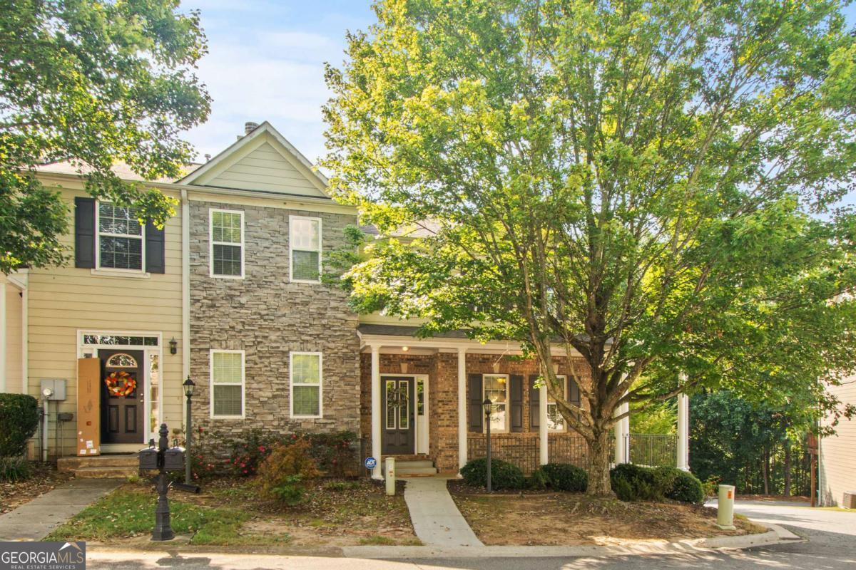 Fantastic townhome in a supreme location! You'll love everything about this end-unit townhome in the desirable Hidden Springs community of Holly Springs. New carpet throughout, newly redone deck, and new tankless water heater! As you arrive, the wrap-around front porch provides a welcoming place to sit and sip your morning coffee. Heading into the main level, you'll find an open concept living room with fireplace that flows into the bright dining area and roomy kitchen. Lots of cabinet space for storage! A private deck off the back of the home offers the perfect place for grilling and chilling. Upstairs has two roomy bedrooms, each with their own ensuite bathroom. The basement has another room with closet and egress through the drive-under two-car garage. This would be a great flex space for a game room, office, or exercise room. Lots of options! The neighborhood has wonderful amenities - pool, tennis courts, dog park and club house. Ideally located and move-in-ready! Call today to schedule your private showing.