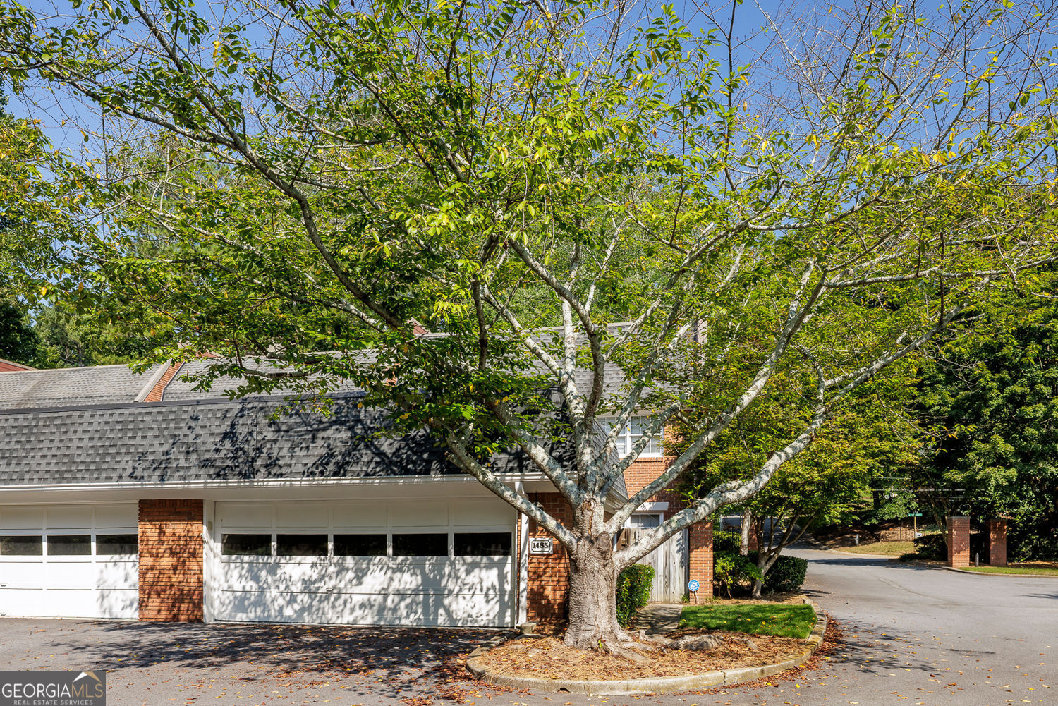 Rare Opportunity in Ashford Place - Exquisite Renovated End-Unit Townhome. Discover a truly exceptional offering in the sought-after community of Ashford Place. This absolutely gorgeous, fully renovated end-unit townhome is a rare find-impeccably maintained, thoughtfully updated, and move-in ready. Bathed in natural light, the home showcases hardwood floors throughout, custom finishes at every turn, and an Elfa closet system in every closet for seamless organization. Enter through a private courtyard into the spacious living room, where a granite fireplace with custom lighted built-ins sets an elegant tone. The living space flows effortlessly into the stunning new kitchen, designed for both beauty and function. White cabinetry, quartz countertops, and a glass subway tile backsplash pair perfectly with a large center island with breakfast bar, stainless steel appliances, and thoughtful details such as a gas cooktop with pot filler, vent hood, coffee bar, and pop-up electrical socket. Multiple pantries, a mudroom side entrance with umbrella stand from the garage, and abundant storage add convenience, while the open dining area leads to a large private deck, perfect for entertaining. A main-level office provides the ideal work-from-home retreat, while the upper level boasts an oversized owner's suite with a sitting room and a showstopping spa-inspired bath. Dual vanities, a free-standing soaking tub, and an expansive shower create a luxurious retreat, complemented by a spectacular walk-in closet with leaded glass door and a professionally designed closet system with custom cabinetry. Two additional bedrooms share a beautifully updated hall bath, with a laundry room conveniently located upstairs.The terrace level extends the living space with a wet bar illuminated by pendant lighting, a versatile media or playroom, a bedroom with full bath, an exercise room, and abundant storage, all opening to an additional outdoor living area. The oversized two-car garage offers even more storage, along with a floored attic, Ecobee Smart thermostats, and a Flow Logic leak detection system for peace of mind. Residents of Ashford Place enjoy a sparkling pool, beautifully maintained greenspace, and a warm community setting that feels both private and welcoming. Plenty of guest parking available. Perfectly positioned in the heart of Brookhaven, this townhome offers easy access to top-rated schools including Montgomery Elementary and Marist. Outdoor enthusiasts will love walking to Murphey Candler Lake with its trails, nearby Blackburn Park and Tennis Center, and Cowart YMCA. Just minutes from shopping, dining, and Chamblee's vibrant mid-city district, with convenient access to I-285 and all that Atlanta has to offer, this home combines refined living with everyday convenience.