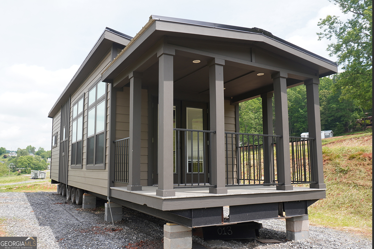 Turnkey 2023 Sierra Model tiny home on 0.34-acre Lot #57! This 397 sq ft, 12' x 43' park model offers 1 bedroom, 1 bath, and a covered front porch-perfect for enjoying peaceful outdoor living. Peaceful Meadows spans 28 acres and will feature 78 homes at completion. Residents enjoy a peaceful, community-oriented lifestyle with modern amenities including paved roads, water, septic, high-speed internet, and professionally maintained landscaping in shared green spaces. Future amenities under development include: * Gated entrances * Clubhouse with fitness room & pavilion * Picnic area * Pickleball court * Dog park Please note: Home is not available for occupancy until utilities are installed and final setup is complete-estimated move-in ready by early July 2025. Active construction site - use caution when visiting.