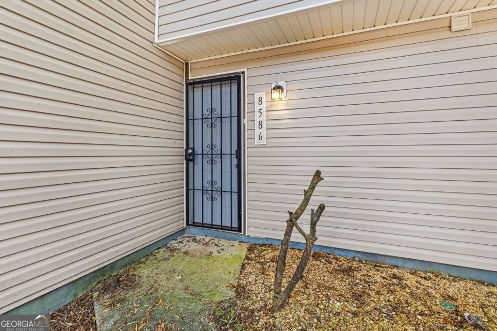 Photo of 8586 Creekwood Way, Jonesboro, GA 30238 (MLS # 10659355)