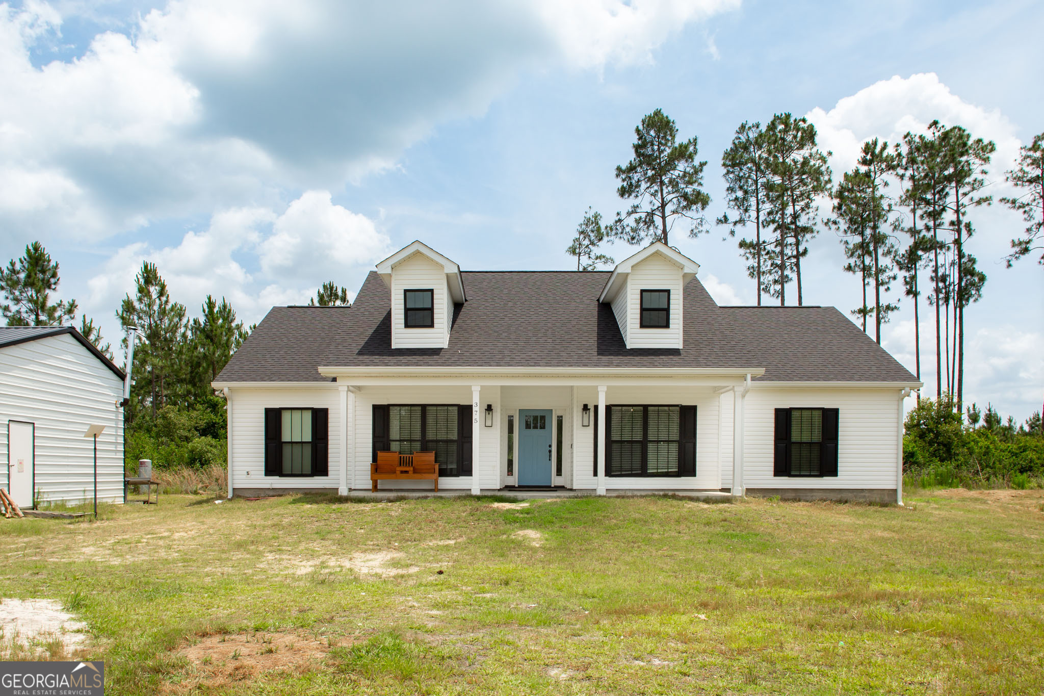Beautiful 4 bedroom home built in 2023 in the midst of 40 acres. Much of the acreage features income producing planted pines. This property is located just west of Waycross, only about 10 minutes from the heart of town. You'll enjoy privacy and seclusion in your beautiful home! Inside this 2001 heated sqft house you'll find an open floorplan, formal dining, gorgeous beamed vaulted ceiling, custom cabinetry, along with many other beautiful features. A 20X30 prefab metal garage with 2 bay doors, insulation, electricity and an a/c unit to keep you cool while you work is situated conveniently next to the house. A small garden area as well as a pond are also located near the house. Your homestead awaits!