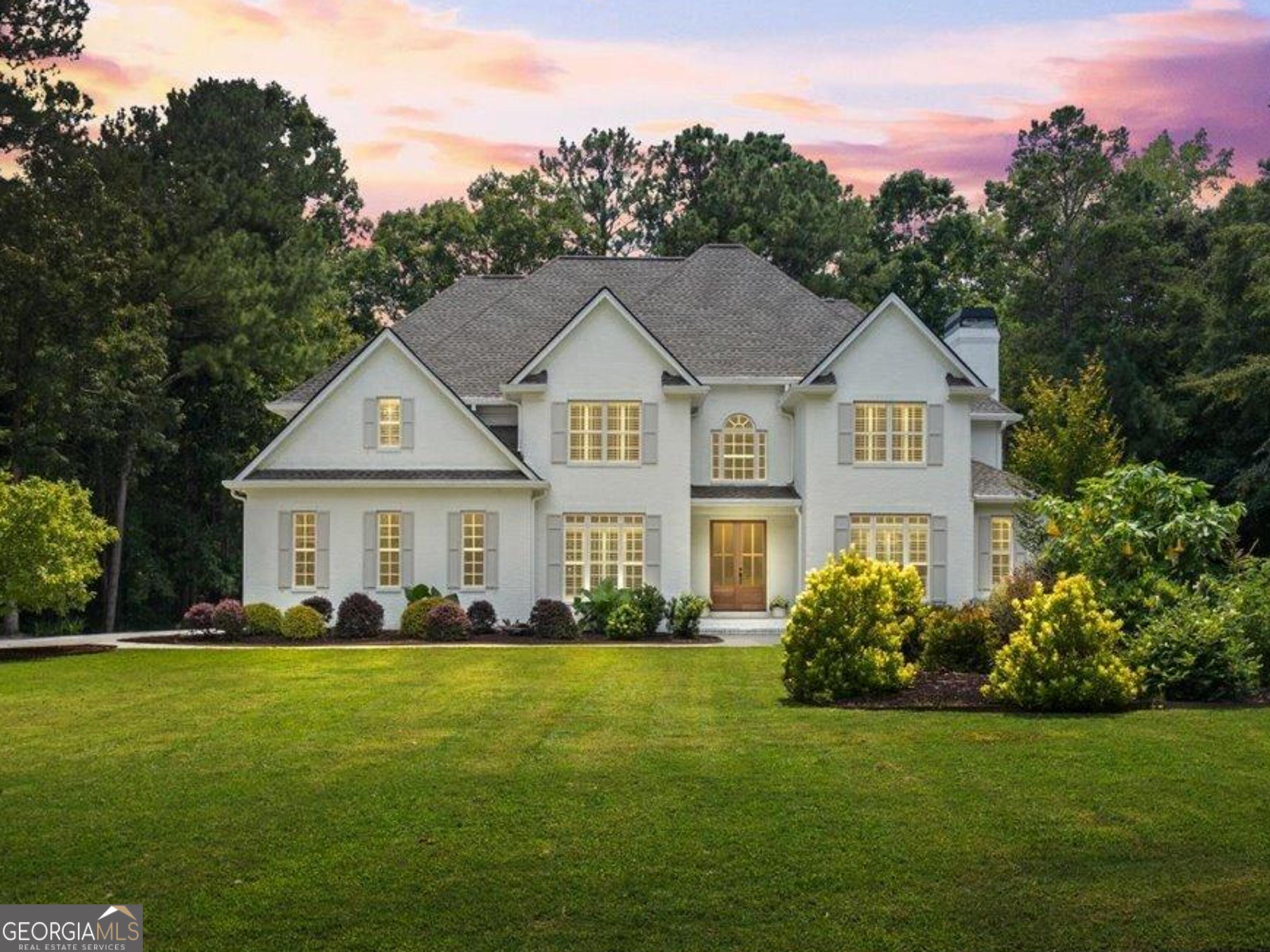 Nestled in the trees of Ashley Forest, just a short drive from Trilith Movie Studios, this stunning, 5000+ newly remodeled home is a must see! This 5 bedroom 4.5 bathroom home has everything you are looking for! Enter the beautiful foyer through the mahogany French doors, a formal dining room on your left and a cozy sitting room will be on your right. Open and bright kitchen with quartz countertops, and all new GE appliances, overlook the large family room with a fireplace and built-in bookcases. With enough natural light shining in through the backyard windows. Complete with a luxurious, spa suite, primary bathroom with soaking tub and sauna, luxury vinyl flooring throughout, and two completely remodeled en suite bathrooms. Amazing brand, new composite deck, perfect for entertaining. You can watch the deer roam and enjoy the beautiful morning bird songs with your cup of coffee. You can also unwind in the evening in the extra large hot tub under the starry sky. There is a fully finished basement with plenty of room for any guests, In-laws, or teenage suite. Don't miss your opportunity to come and see this home and make it your own!