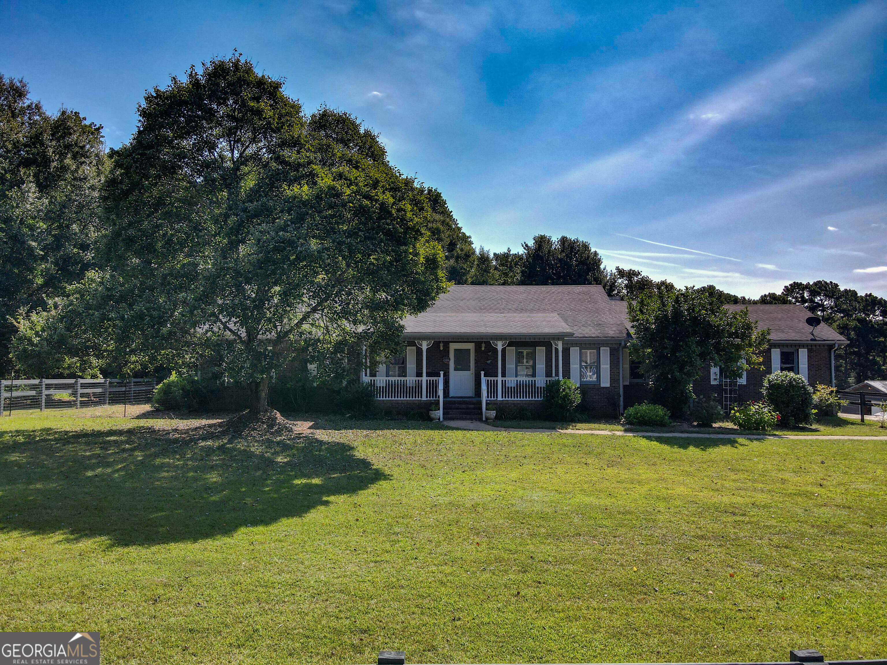 This property brings together two parcels - 4.43 acres and 2.41 acres, offering nearly 7 acres of opportunity. Inside, you'll find a welcoming living space, large family room, a foyer and fireplace, screened-in back deck and a large 2-car garage with high ceilings. On the exterior, a 36x60, 7-stall horse barn with running water and its own electric meter, giving you flexibility to keep it as-is or convert it to your vision. Add in the well-maintained horse arena and this rare setup for equestrian, farm or hobby use at this price point. Properties with this much land and potential don't come around often - schedule your showing today!