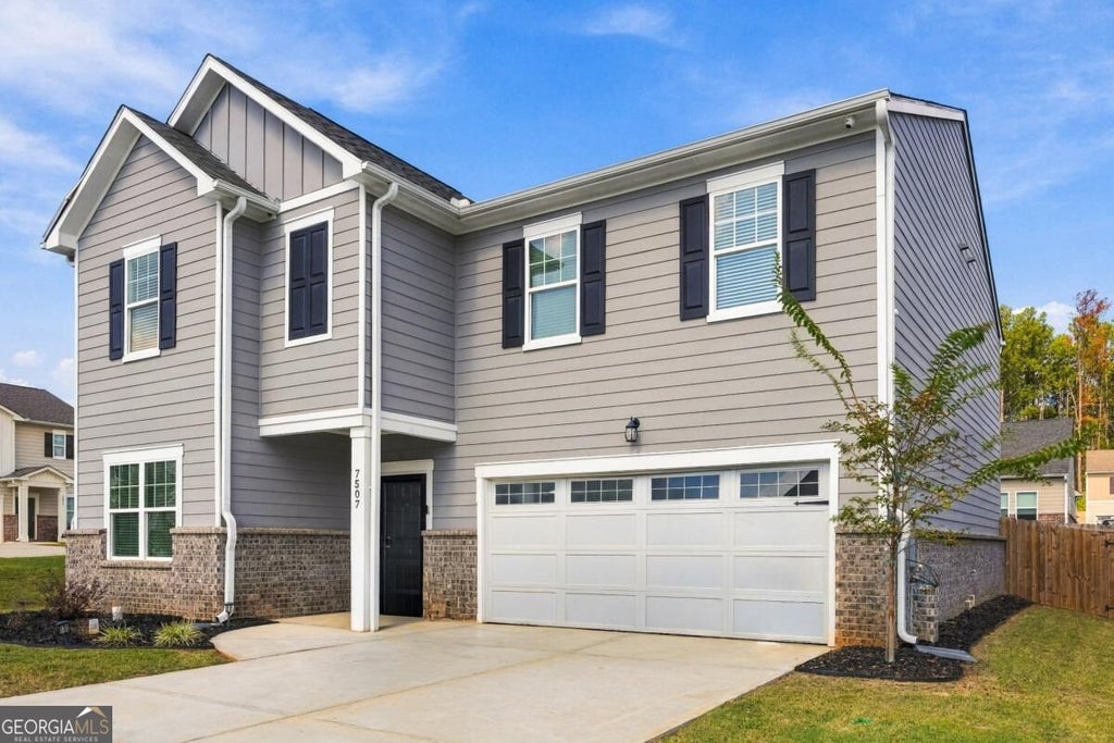 Photo of 7507 Saffron Avenue, Covington, GA 30014 (MLS # 10880732)
