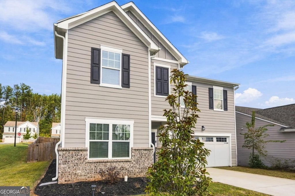 Photo of 7507 Saffron Avenue, Covington, GA 30014 (MLS # 10880732)