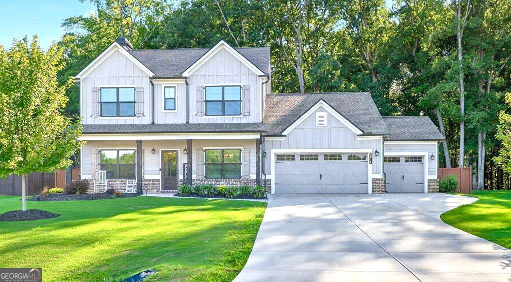 Welcome home!!Built in 2022! Nestled on a beautifully landscaped 1-acre fenced lot, this stunning home combines luxury, functionality, and privacy. Step inside to find a thoughtfully designed floor plan with high-end finishes throughout. Featuring 4 bedrooms, 3 full baths. Guest bedroom/office on main. The chef's kitchen is the true heart of the home, featuring premium appliances, ample counter space, custom cabinetry, and a large island perfect for entertaining and gathering. Enjoy spacious living areas filled with natural light, a cozy fireplace, and seamless indoor-outdoor flow to your private backyard oasis-ideal for pets, play, or peaceful evenings under the stars. Car enthusiasts and hobbyists will love the 3-car garage, offering plenty of room for vehicles, storage, or a workshop. Located in a sought-after community in Monroe, this home offers both convenience and charm, with easy access to local dining, shopping, and schools. Don't miss the opportunity to make this beautiful property yours-schedule your private tour today!