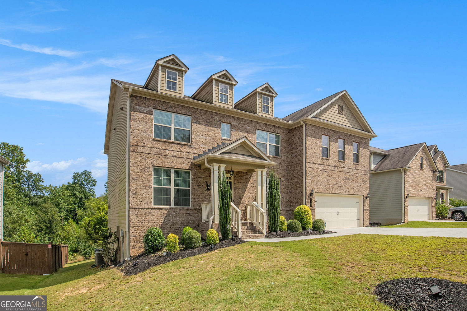 This home offers 5 bedrooms and 4 bathrooms across three levels, blending comfort, function, and entertainment. The main level features one bedroom with it's en suite, perfect for guests or multigenerational living. The open kitchen boasts a large island with seating for up to five, a spacious pantry, and a breakfast area, all flowing seamlessly into the family room with a cozy fireplace. A formal dining room comfortably seats up to eight, making it ideal for gatherings and special occasions. The mud room adds extra convenience and organization for busy households. Step outside to enjoy your patio, perfect for entertaining or relaxing outdoors. Upper Level Upstairs, you'll find four bedrooms, including an expansive owner's suite with a luxurious bath and a large walk-in closet. Three additional secondary bedrooms provide plenty of space for family or guests. Conveniently located on this level is the laundry room, saving you trips up and down the stairs. The partially finished basement is an entertainer's dream, featuring a custom movie theater that seats up to ten for an unmatched cinematic experience.