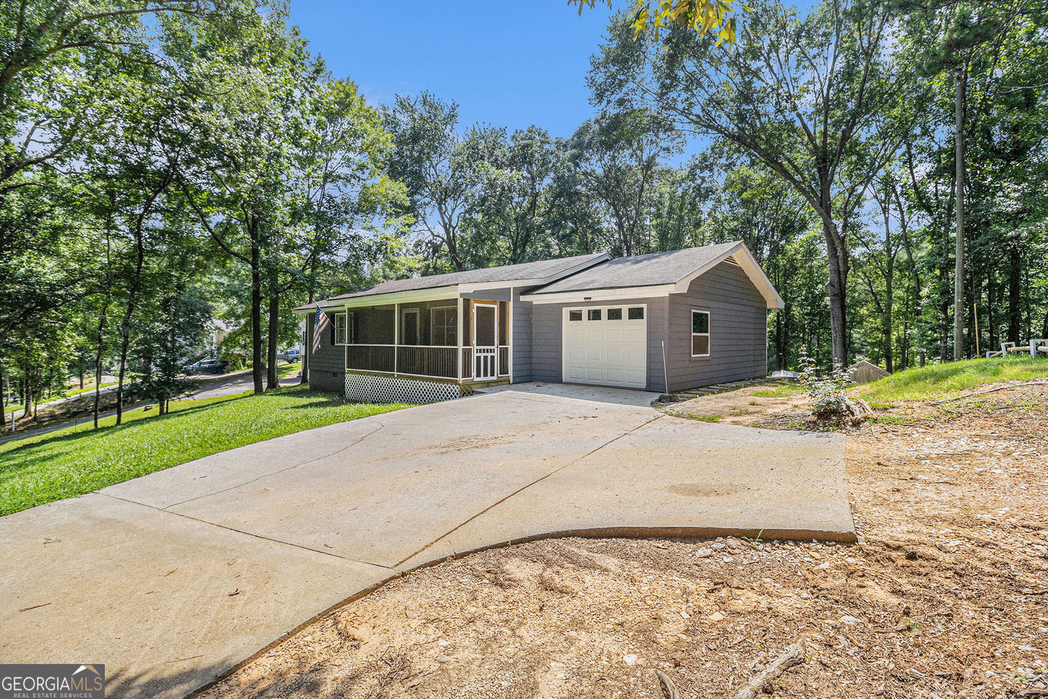 Welcome Home! Beautiful 2 Bed, 2 Bath ranch style home wiith excellent schools! and on amost 1 acre! Enjoy the ease of 1 story living with hardwood flooring throughout the home an one car garage that could be used as a exercise room or workshop or a bonus room. Entertain family and friends on covered screened-in front porch. Plenty of parking for your guests. No HOA! Lots of potential to make it your own! excellent location in growing area! New interior paint, new light switches. Located just minutes from shopping, dining, and entertainment options.