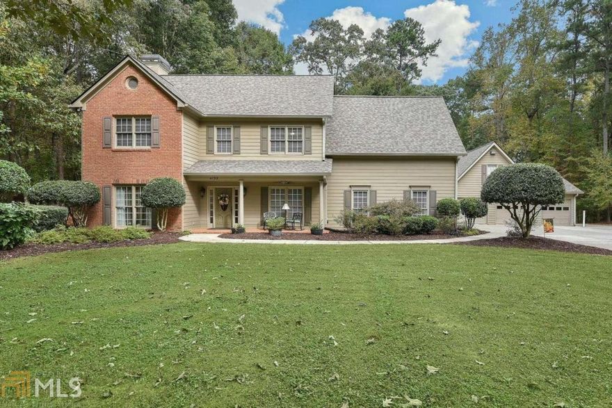 Stunning and unique 4 Bedroom 3 & -+ Bath updated home with large master suite on main (added by current owners) along with a 2nd master suite up. Main level features a foyer, fireside living room, formal dining room, sunroom & large gourmet kitchen with tons of cabinet space overlooking a fireside family room with breakfast area. The 2nd level includes a 2nd luxurious master suite with updated spa bath, 2 large secondary bedrooms, a 2nd full bath and an oversized laundry room that can be easily converted back into a 5th bedroom if desired. New Roof in 2020, newer HVAC.Updated & very well maintained home featuring an open floor plan with gorgeous hardwoods throughout the main level & extensive moldings. Private one-acre lot with fenced back yard, storage shed & large covered RV or boat parking pad in addition to a 2 & -+ car oversized, heated, detached garage with storage room above & large workshop room in back. Half garage perfect for motorcycles, ATVs or Golf Cart. Owner has french doors to both entries to current dining room which would make a great office, room with pool table is next to kitchen and would make a great dining room. Enjoy the park like setting of this property from your covered rocking chair front porch, screened in covered rear porch, and large courtyard style patio. Conveniently located in the heart of Forsyth County near restaurants, shopping, and top-notch health care with Northside Hospital Forsyth less than 3 miles away.